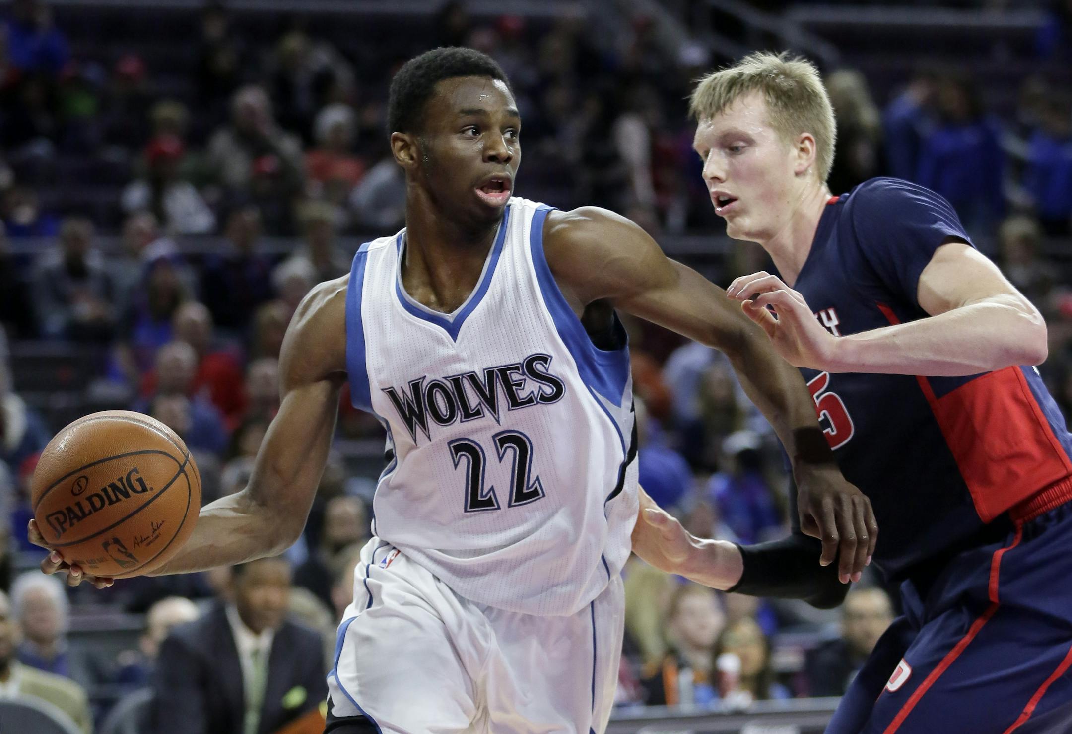 The Timberwolves' Andrew Wiggins looked to pass against the Pistons' Kyle Singler during the first half Sunday.
