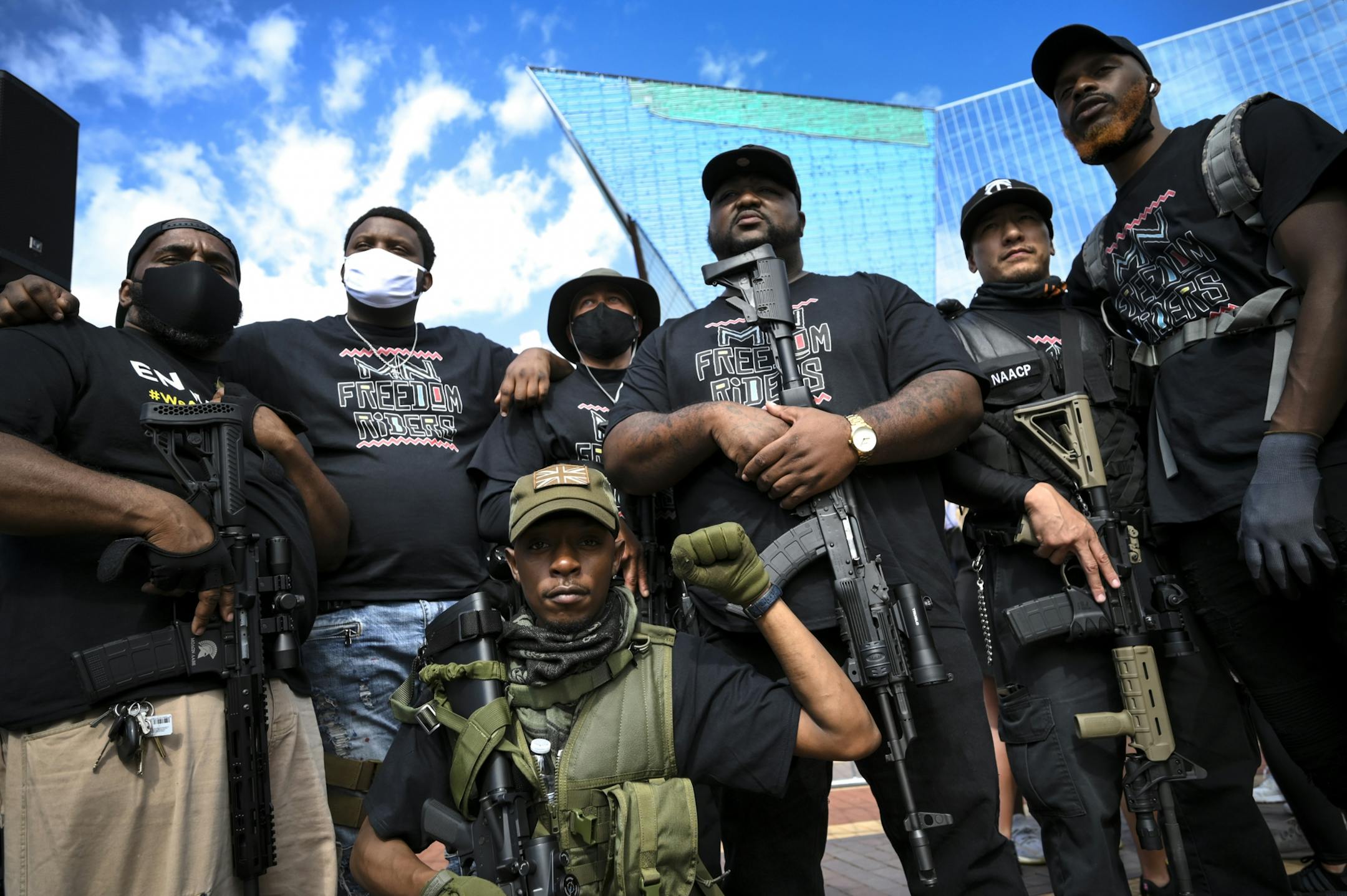 Members of the NAACP's Minnesota Freedom Riders posed for photos in front of US Bank Stadium Saturday afternoon before the start of the 10k March for a Free North.