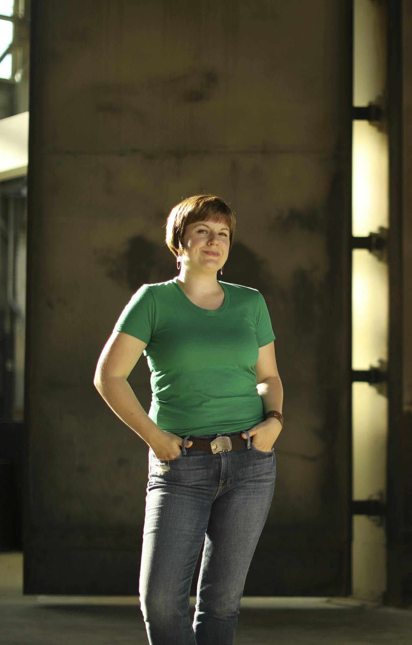 Mercedes Austin, founder and owner of Mercury Mosaics, near a former paint booth repurposed as a conference room in her company's new workshop. ] JEFF WHEELER &#xef; jeff.wheeler@startribune.com The tile maker Mercury Mosaics is up and running in their new Thorp Building location in Northeast, though finish work on their new space is still yet to come. The business and founder Mercedes Austin were photographed Wednesday afternoon, August 23, 2017 in Minneapolis.