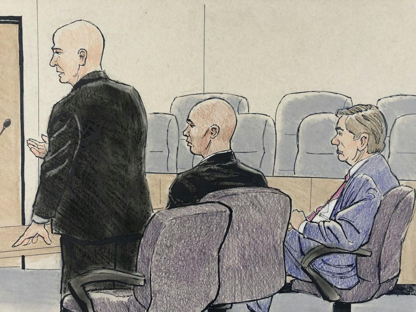 Defense attorney Thomas Plunkett, left, addresses the court whole Mohamed Noor and co-counsel Peter Wold look on.