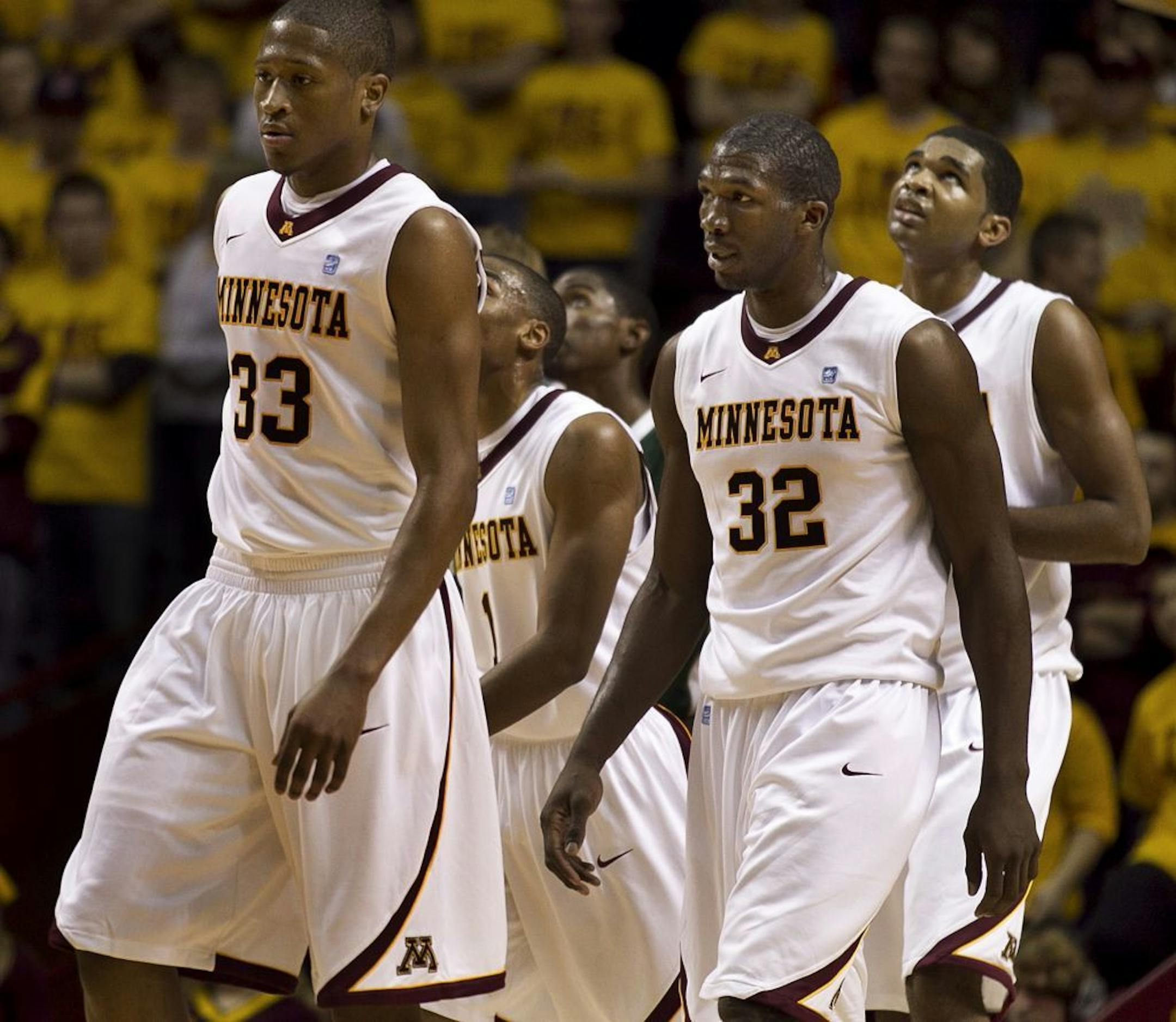 Rodney Williams left, and Trevor Mbakwe