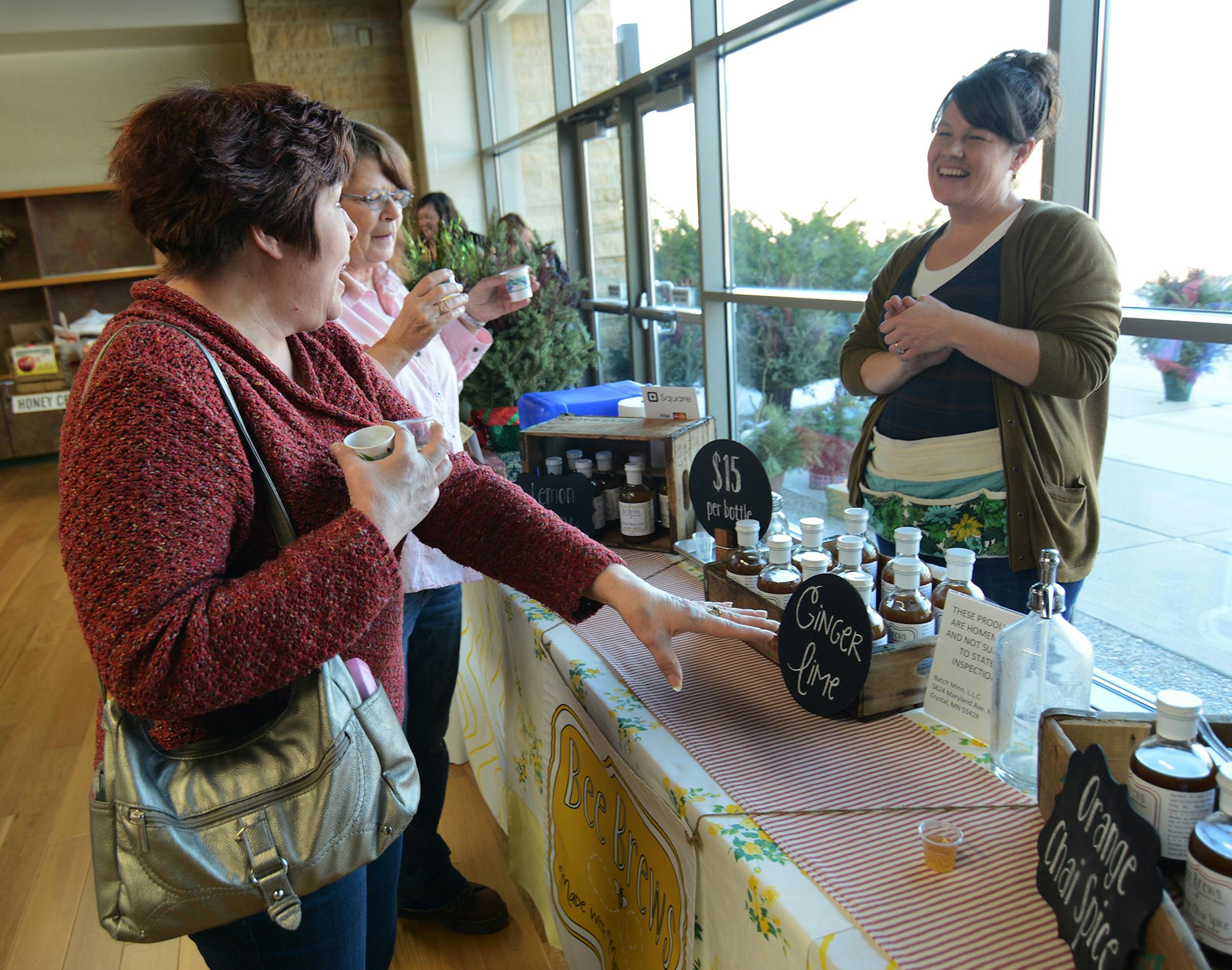 (left to right) Pam Zrust, of Hastings, and Dawn George, of Northeast Minneapolis, sampled some of Brandee Hanson‚Äôs Bee Brews syrups. Photo by Liz Rolfsmeier, Special to the Star Tribune