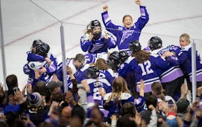 Frost teammates celebrate after taking the PWHL title with a 2-1 overtime victory over Ottawa on Monday at Xcel Energy Center.