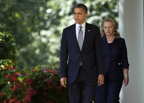 Secretary of State Hillary Clinton follows President Barack Obama to the Rose Garden of the White House in Washington, Wednesday, Sept. 12, 2012, to d