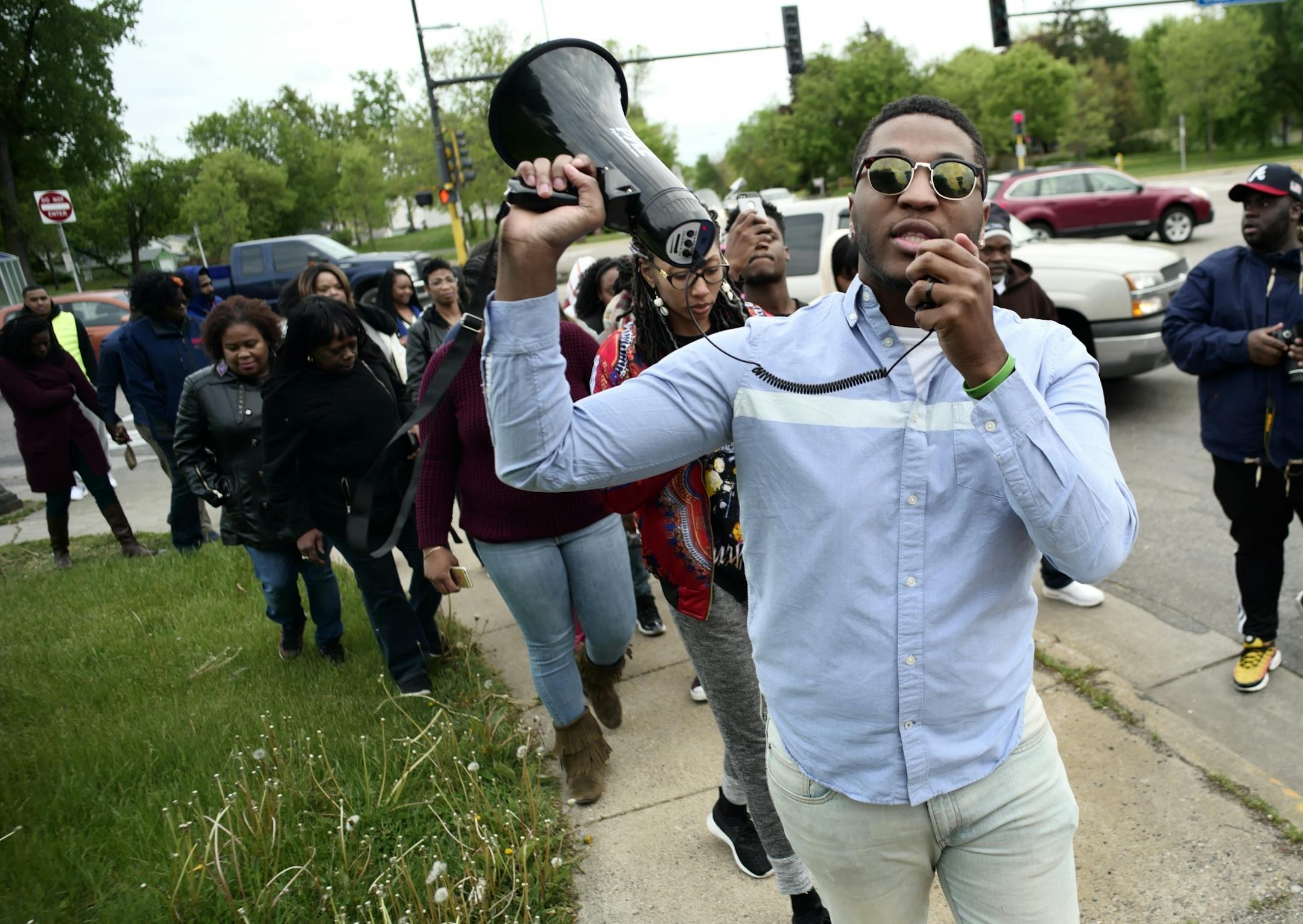 Davonte Patton leads a walking prayer vigil near the memorial.