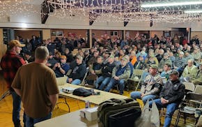 Attendees fill Morrill Hall on Dec. 18, with State Rep. Isaac Schultz (left) and Scott Porter at the front.