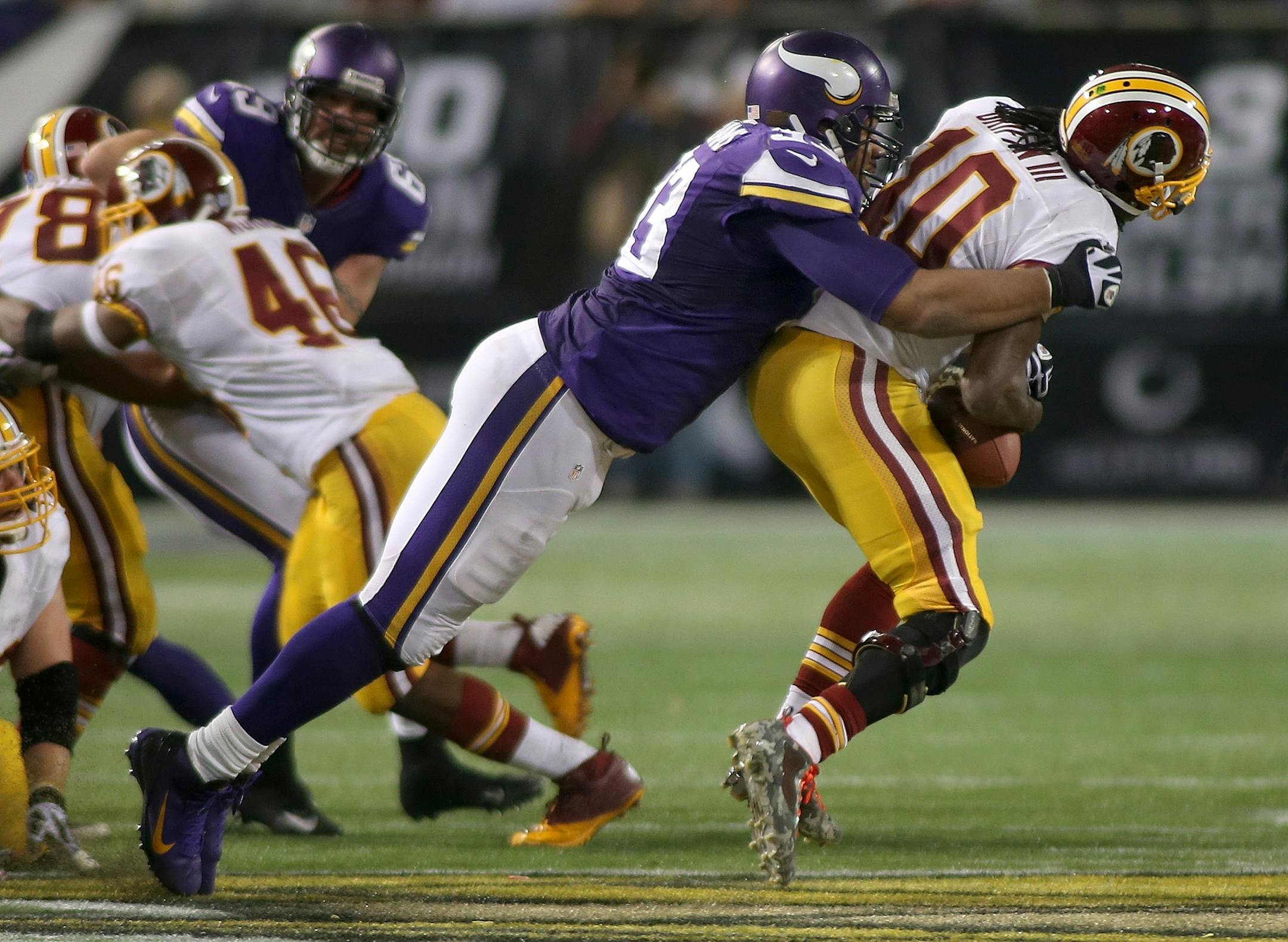 Minnesota Vikings defensive tackle Kevin Williams sacked Washington Redskins quarterback Robert Griffin III in the third quarter November 7, 2013 at Mall of America Field in Minneapolis.
