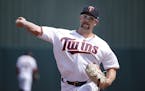 Minnesota Twins pitcher Randy Dobnak warms up for a spring training baseball game against the St. Louis Cardinals, Monday, March 9, 2020, in Fort Myer