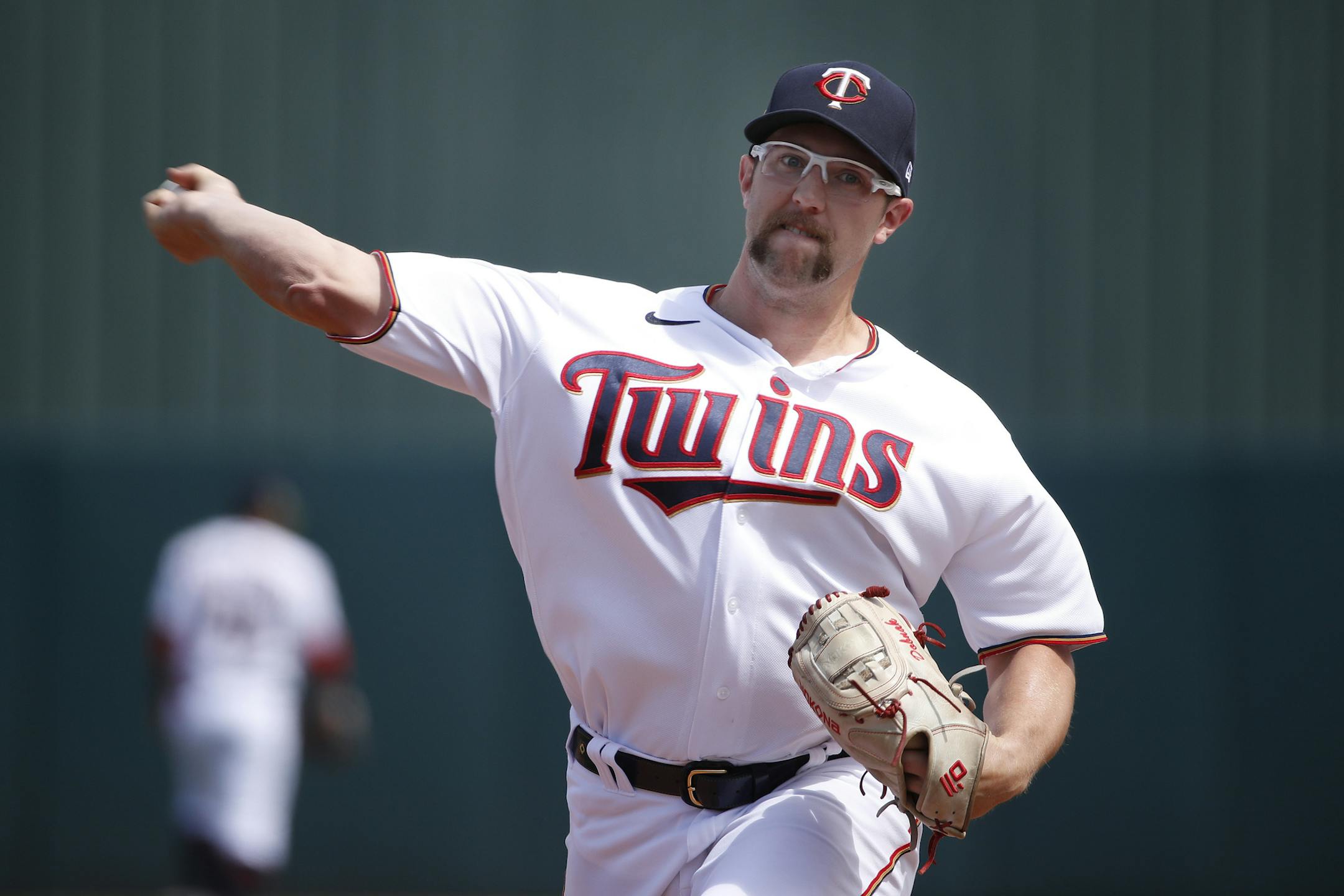 Minnesota Twins pitcher Randy Dobnak warms up for a spring training baseball game against the St. Louis Cardinals, Monday, March 9, 2020, in Fort Myers, Fla. (AP Photo/Elise Amendola)
