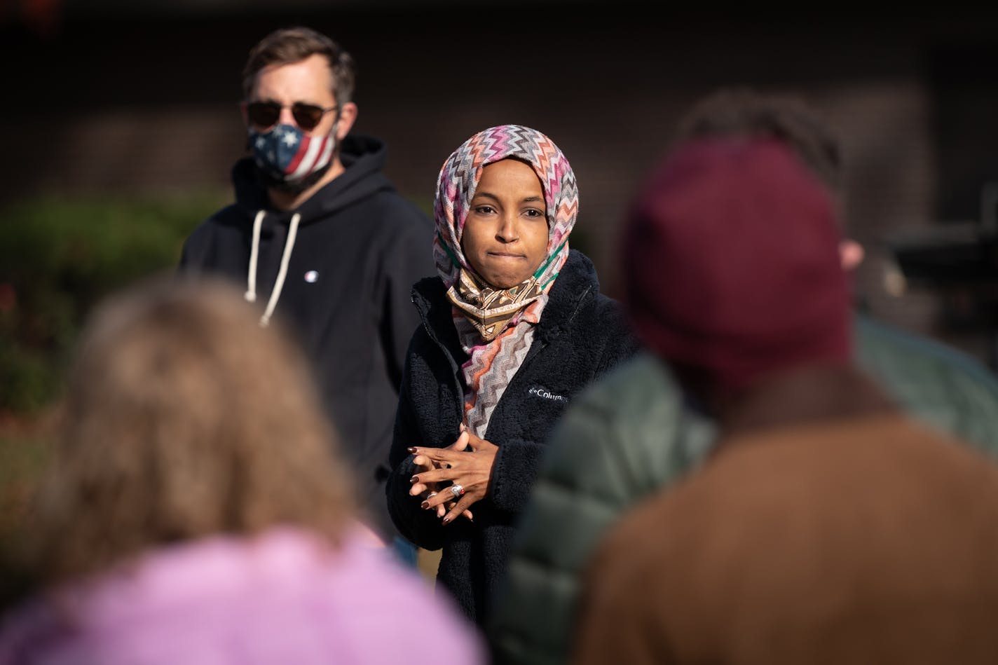 U.S. Rep Ilhan Omar spoke to campaign staffers and volunteers in Minneapolis' Powderhorn Park neighborhood this month before they split into teams to knock on doors ion the neighborhood. On the left is her husband, Tim Mynett.