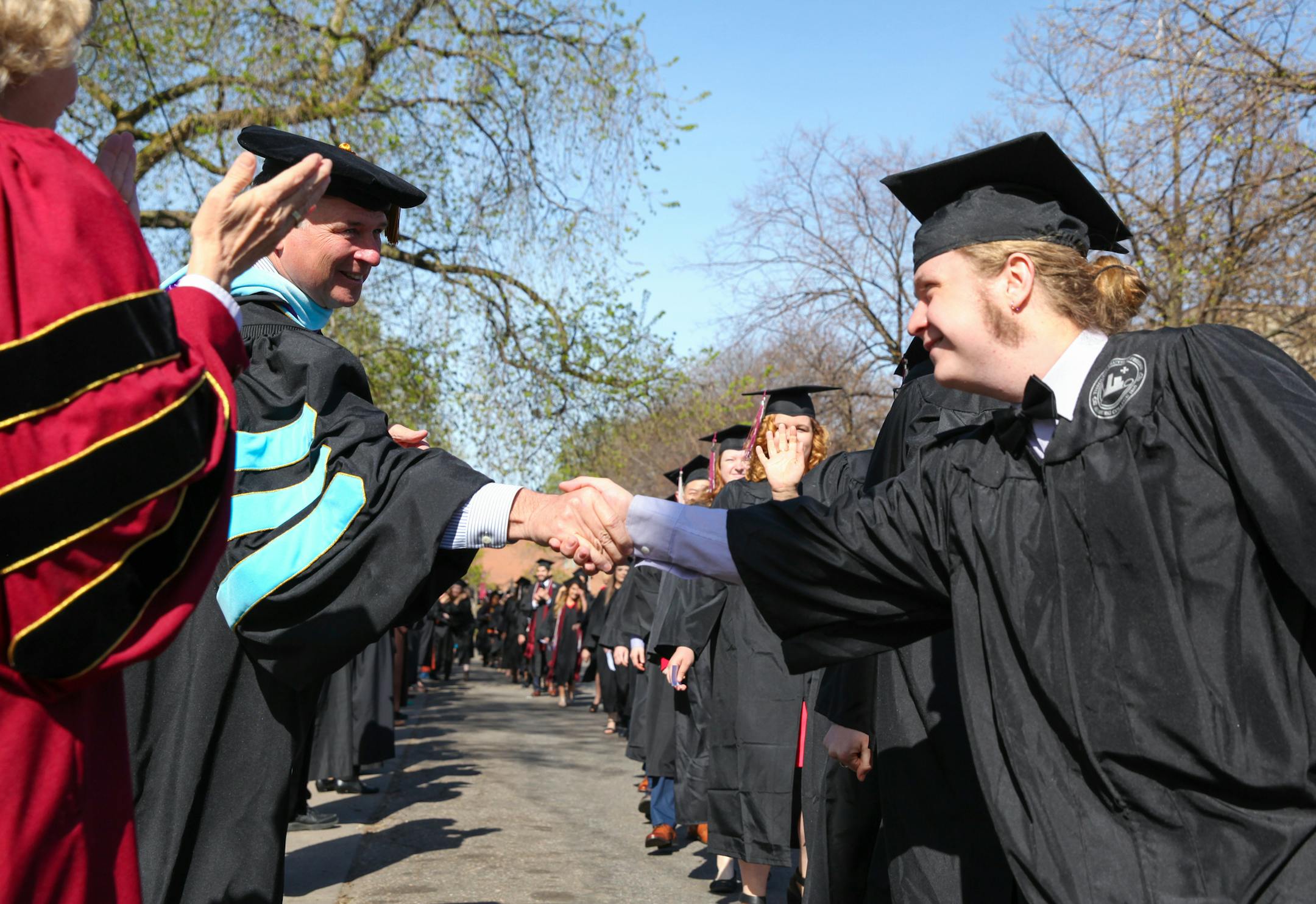English major Connor Doebbert shook hands with Prof. George Dierberger before spring 2017 commencement at Augsburg University in Minneapolis. The number of English majors nationally has been declining, but the skills developed in the discipline are as relevant as ever, and the desire for narrative and story remains strong.