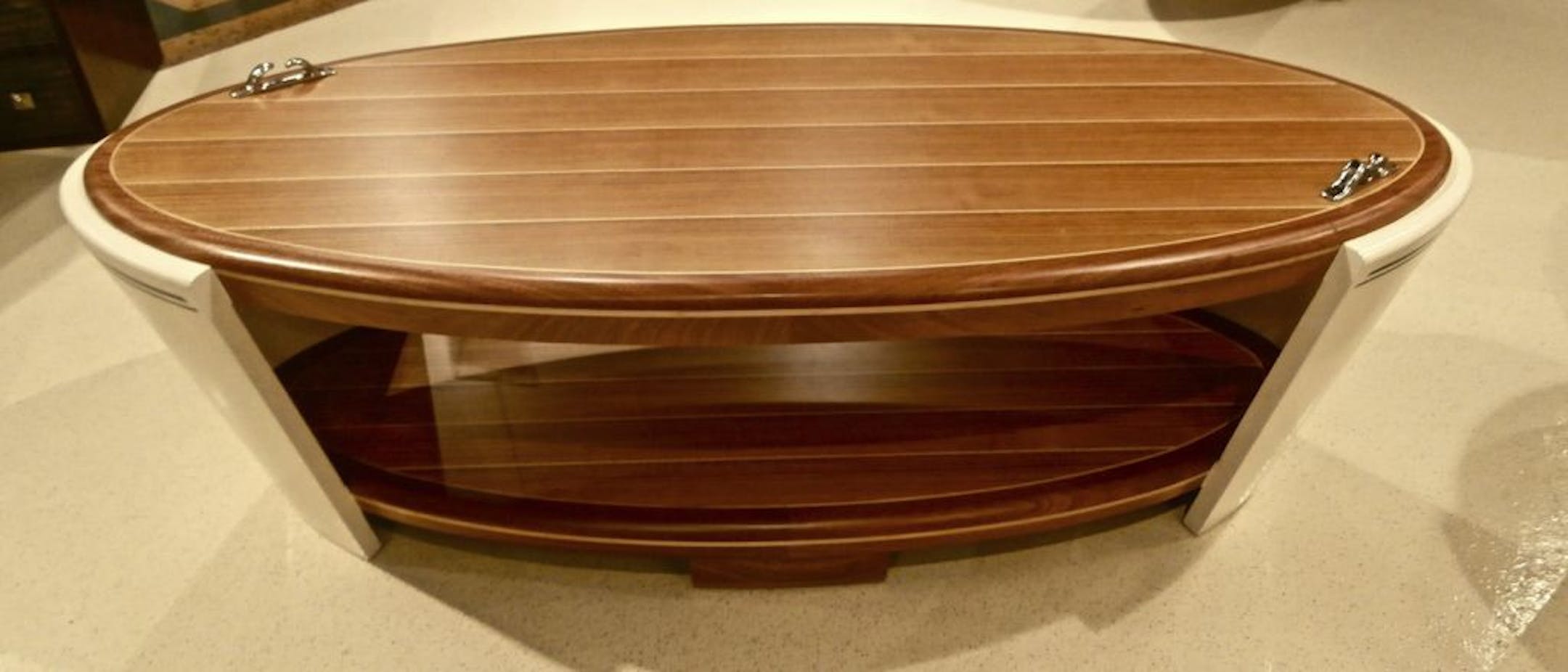 SH12E189NAUTICALDECOR May 28, 2012 -- Theodore Alexander's Yacht cocktail table -- nautically inspired, complete with a curved bow and stern.