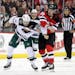 Wild left wing Marcus Foligno and Devils right wing Kurtis Gabriel fight during the second period