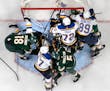 Blues goalie Ville Husso was swarmed during Game 1 on Monday night at Xcel Energy Center.