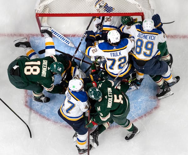 Blues goalie Ville Husso was swarmed during Game 1 on Monday night at Xcel Energy Center.