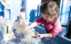 Lana Vue, 2, plays with water at the Minnesota Children's Museum in St. Paul in March 2015.