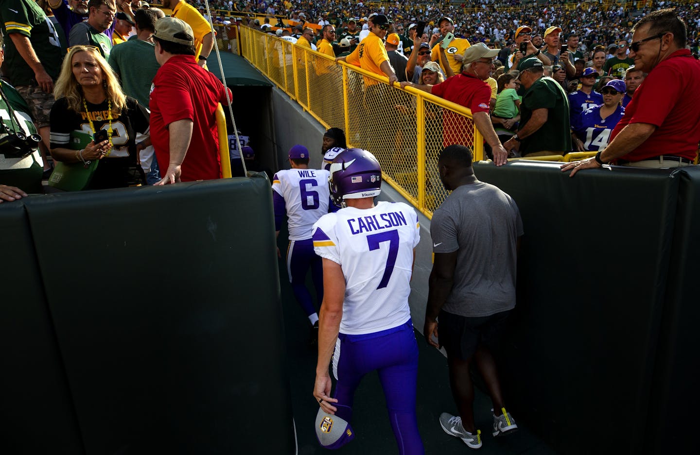 Vikings kicker Daniel Carlson (7) walked off the field after missing a field goal at the end of overtime.