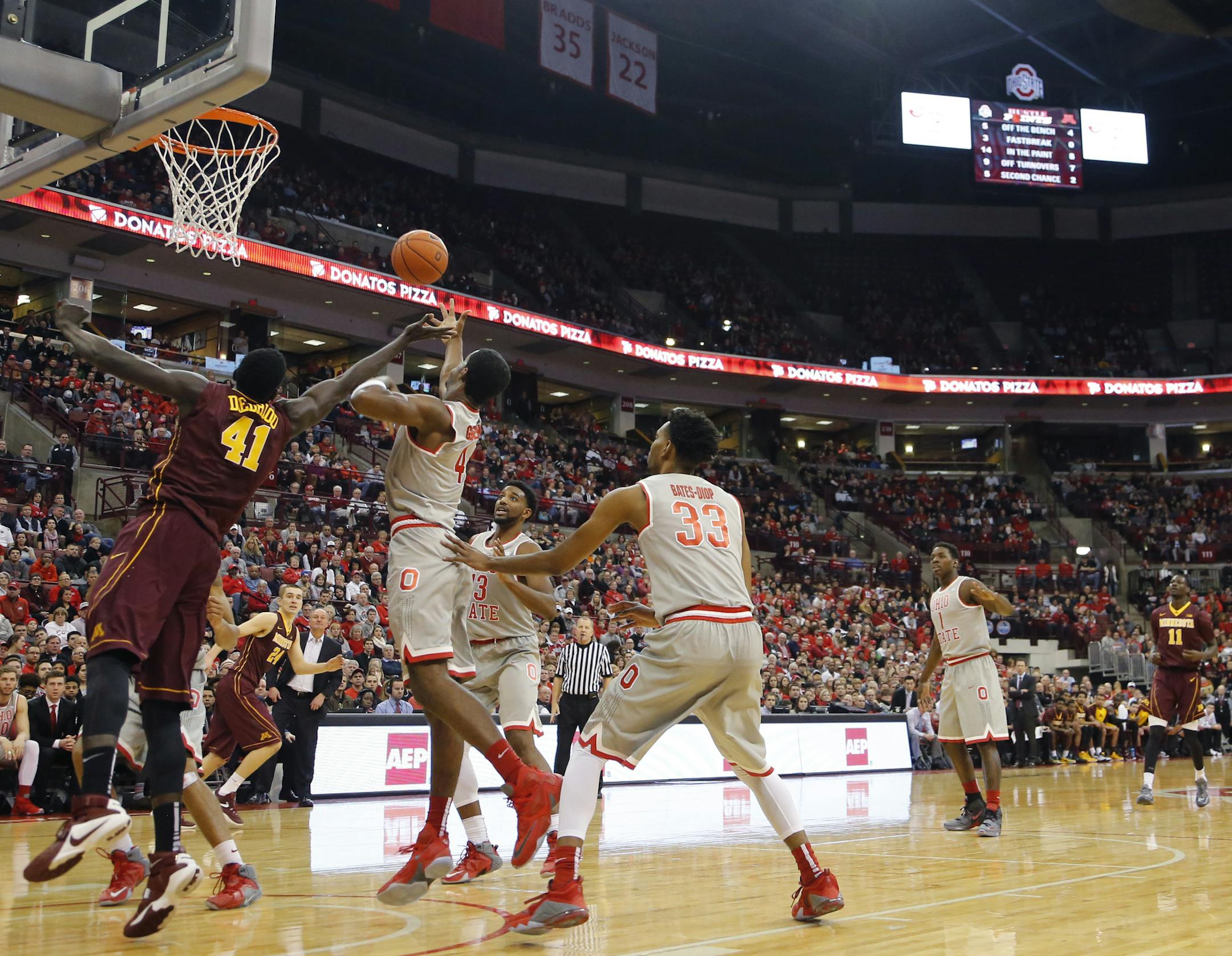 Minnesota and Ohio State players fight for a rebound during the first half of an NCAA college basketball game, Wednesday, Dec. 30, 2015, in Columbus, Ohio. (AP Photo/Jay LaPrete)