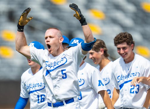 Minnetonka catcher Maxwell Pederson (5) celebrates with his teammates after hitting a walk-off RBI double to defeat Mounds View 4-3 in the seventh inning of a 4A quarterfinals game.