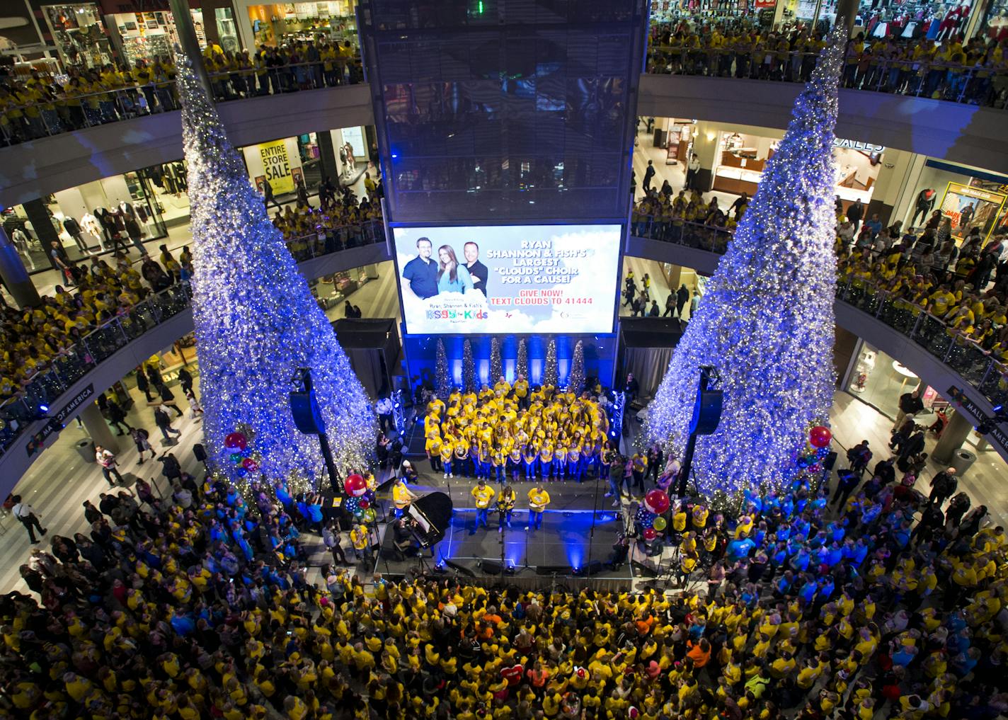 Thousands gathered in the Mall of America rotunda to honor the late Zach Sobiech by singing and recording "Clouds." ] (AARON LAVINSKY/STAR TRIBUNE) aaron.lavinsky@startribune.com Thousands gathered in the Mall of America Rotunda Friday night to honor the late Zach Sobiech and children sick with cancer and other serious illnesses. They sang and recorded Zach's song "Clouds," as well as Christmas carols on Friday, Dec. 11, 2015.