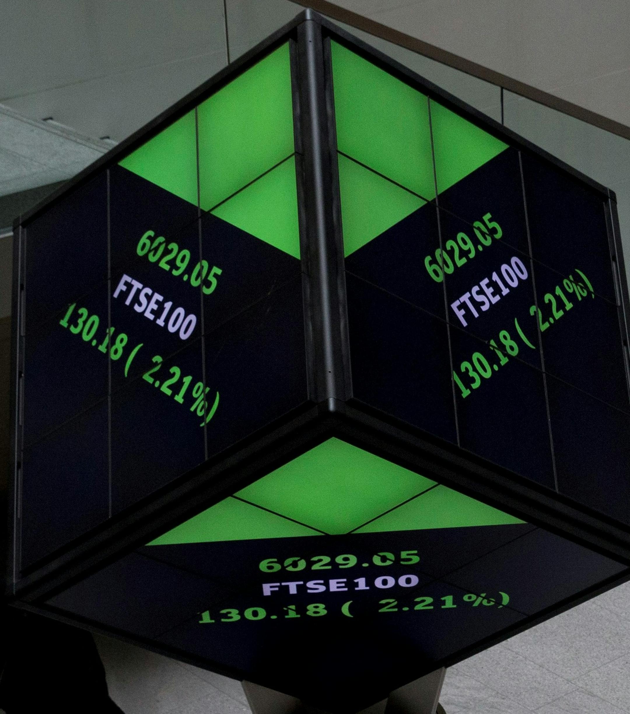 FTSE market information is displayed on a cube-shaped display inside the London Stock Exchange in the City of London, Tuesday, Aug. 25, 2015. Chinese stocks fell Tuesday for a fourth day, hitting an eight-month low amid signs Beijing was no longer buying shares to stem a price slide, and Japanese stocks also dropped. But other Asian and European markets bounced back from a day of heavy losses. (AP Photo/Matt Dunham) ORG XMIT: LMD104