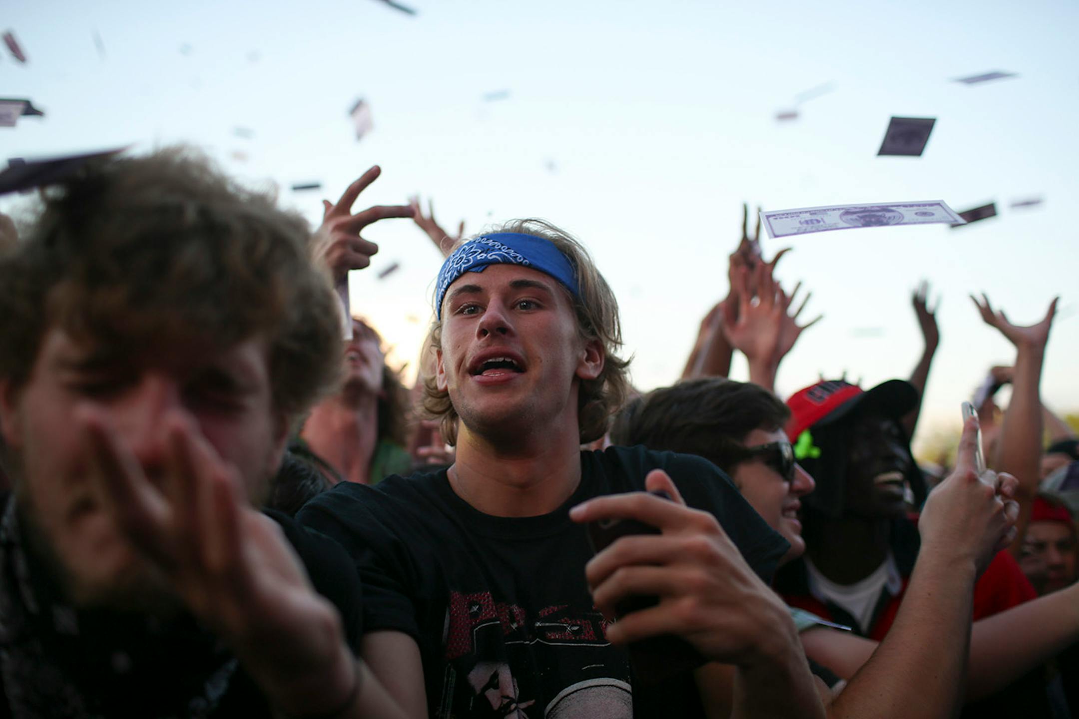 Fans tried to catch play money shot by canons into the air as A$AP Rocky closed out Soundset 2016 on the Main Stage Sunday night at Soundset 2016.