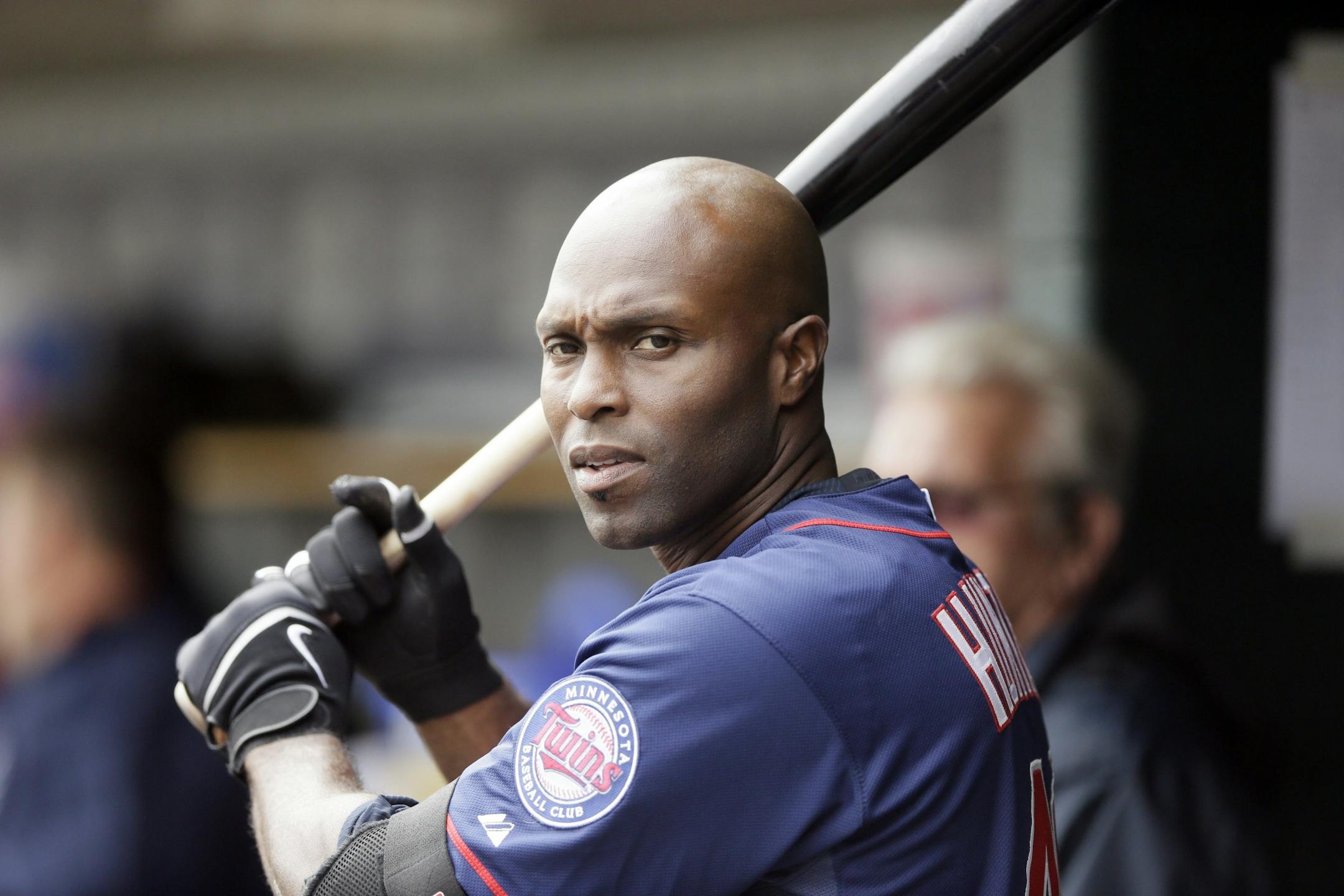 Minnesota Twins right fielder Torii Hunter is seen in the dugout during the sixth inning of an opening day baseball game against the Detroit Tigers in Detroit, Monday, April 6, 2015.