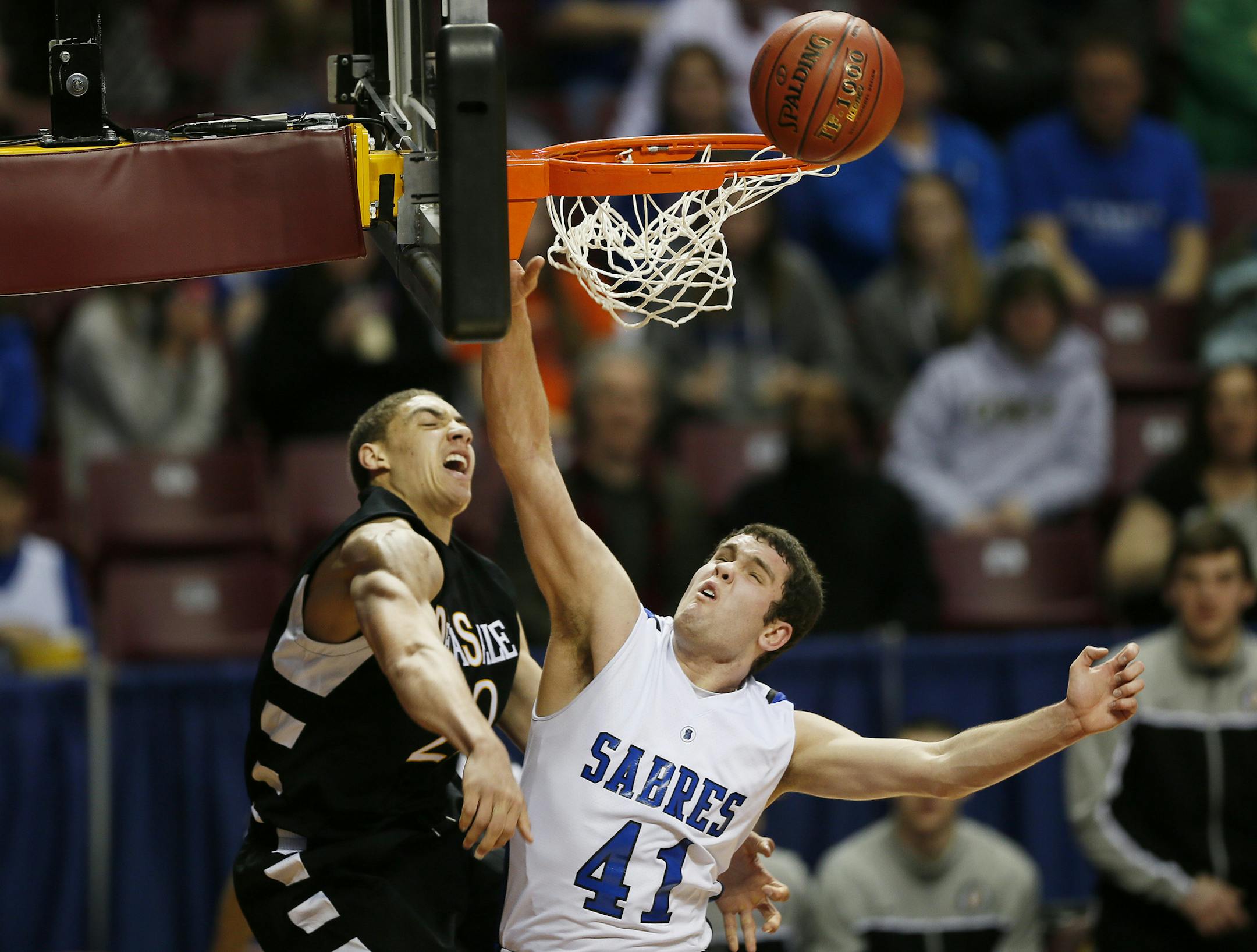 Reid Travis of DeLaSalle battled Park Hagen for and offensive rebound during 3A quarterfinals basketball action between DeLaSalle and Sartell-St. Stephen at Williams Arena Wednesday March, 20, 2013 in Minneapolis, MN. DeLaSalle beat Sartell-St. Stephen 70-55. ] JERRY HOLT &#x201a;&#xc4;&#xa2; jerry.holt@startribune.com