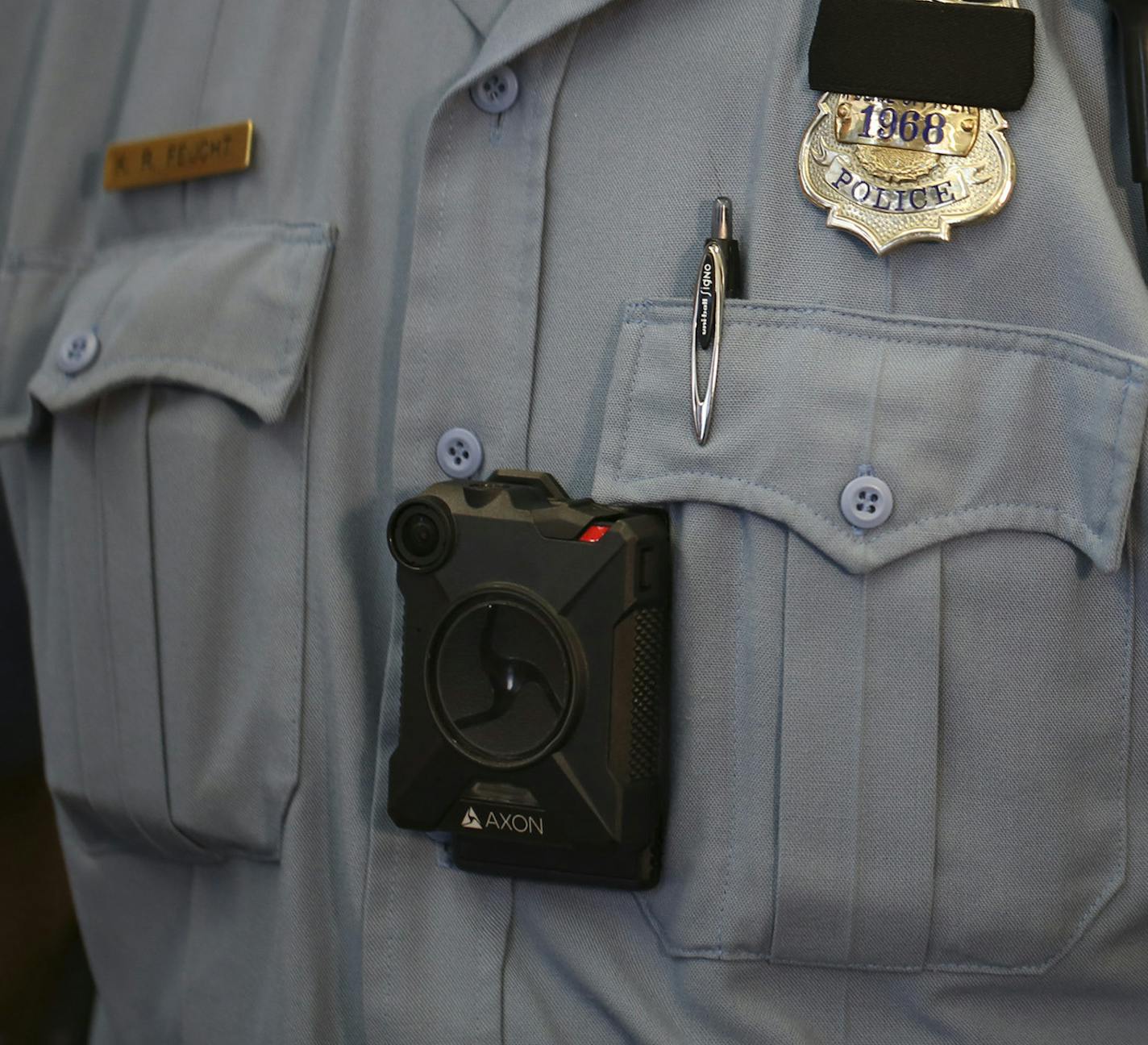 Minneapolis Police Officer Ken Feucht was one of the officers who volunteered for the body camera pilot program. He wore the Axon camera, made by Taser that will be used by the Minneapolis Police Department at the news conference at the First Precinct Police Headquarters Tuesday afternoon. ] JEFF WHEELER &#xef; jeff.wheeler@startribune.com Mayor Betsy Hodges and Police Chief Jane Harteau announced at a news conference Tuesday afternoon, July 19, 2016 that Minneapolis Police Department's Body Cam