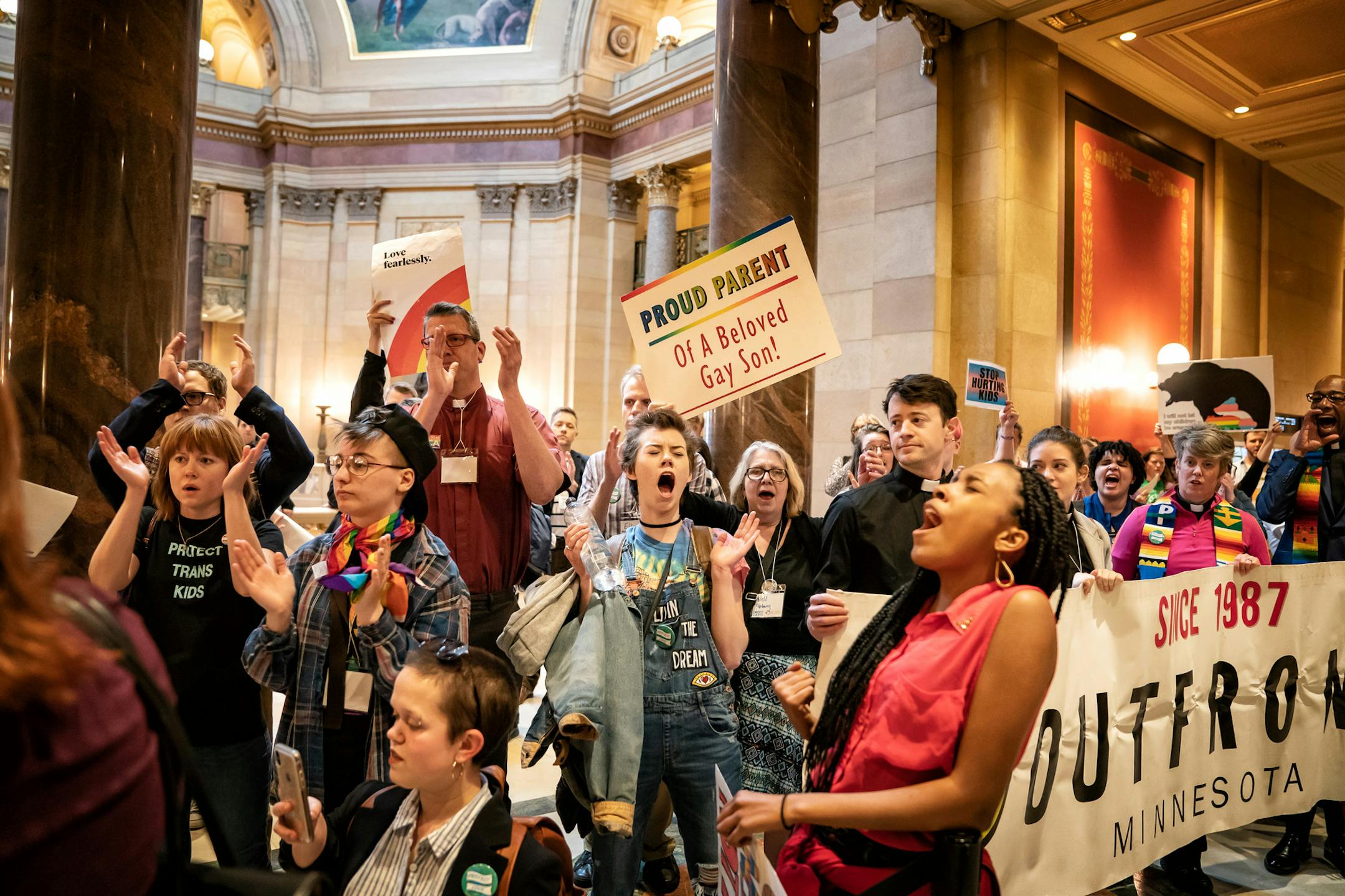 While Rep. Tim Miller, R-Prinsburg, spoke on an amendment about conversion therapy on the House Floor, over one hundred protesters with Outfront Minnesota sang and cheered outside. ] GLEN STUBBE • glen.stubbe@startribune.com Thursday, April 25, 2019 It has been a hectic week at the Minnesota State Legislature with long intense floor debates on a wide range of omnibus bills that will ultimately head to conference committees.