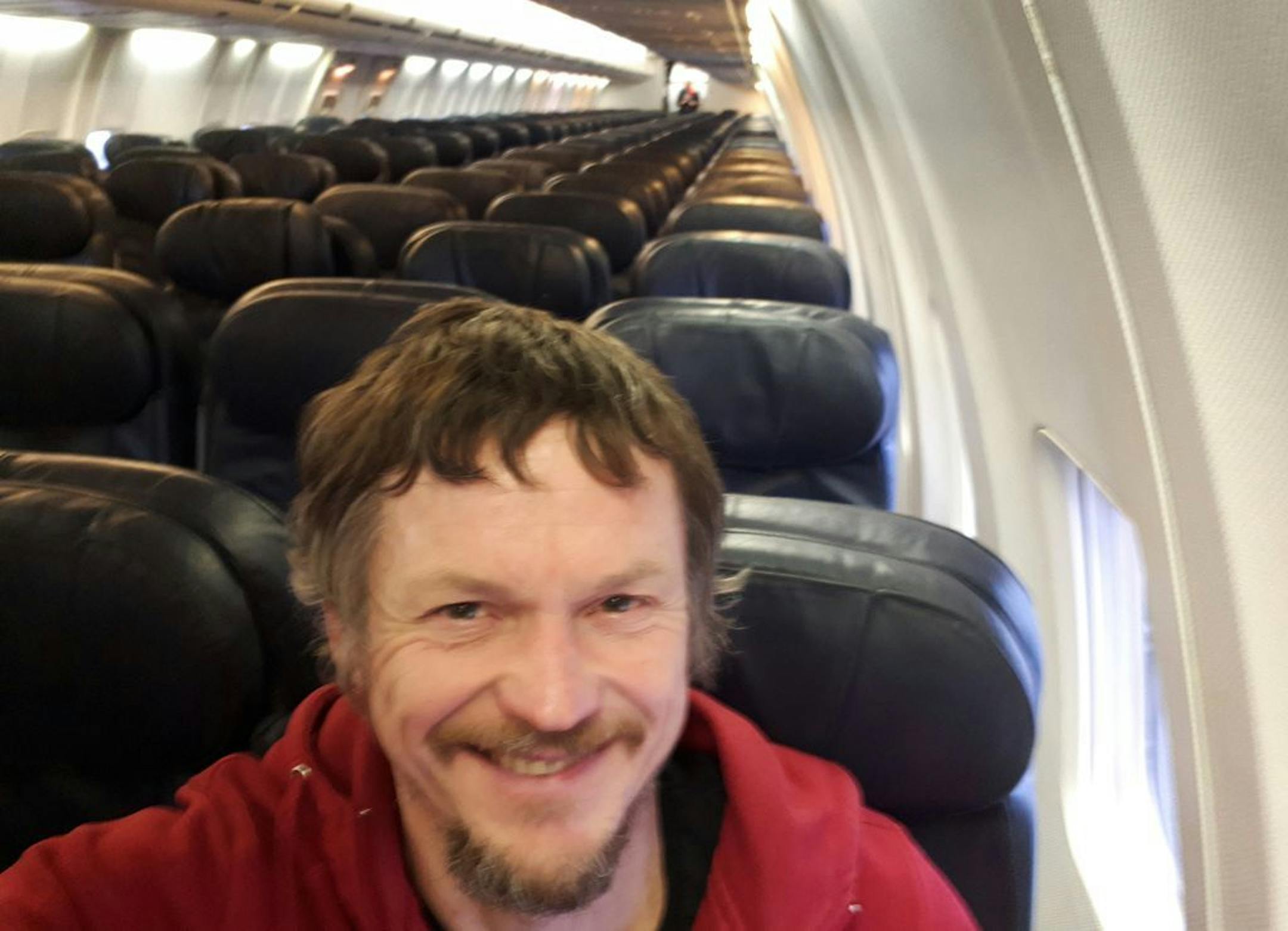 Skirmantas Strimaitis takes a selfie onboard a Boeing 737-800 airplane, taking off from Vilnius, Lithuania, March 16, 2019, as the only passenger aboard. The aircraft with two pilots and five crew members and which usually can sit up to 188 people, flew to Bergamo, Italy.