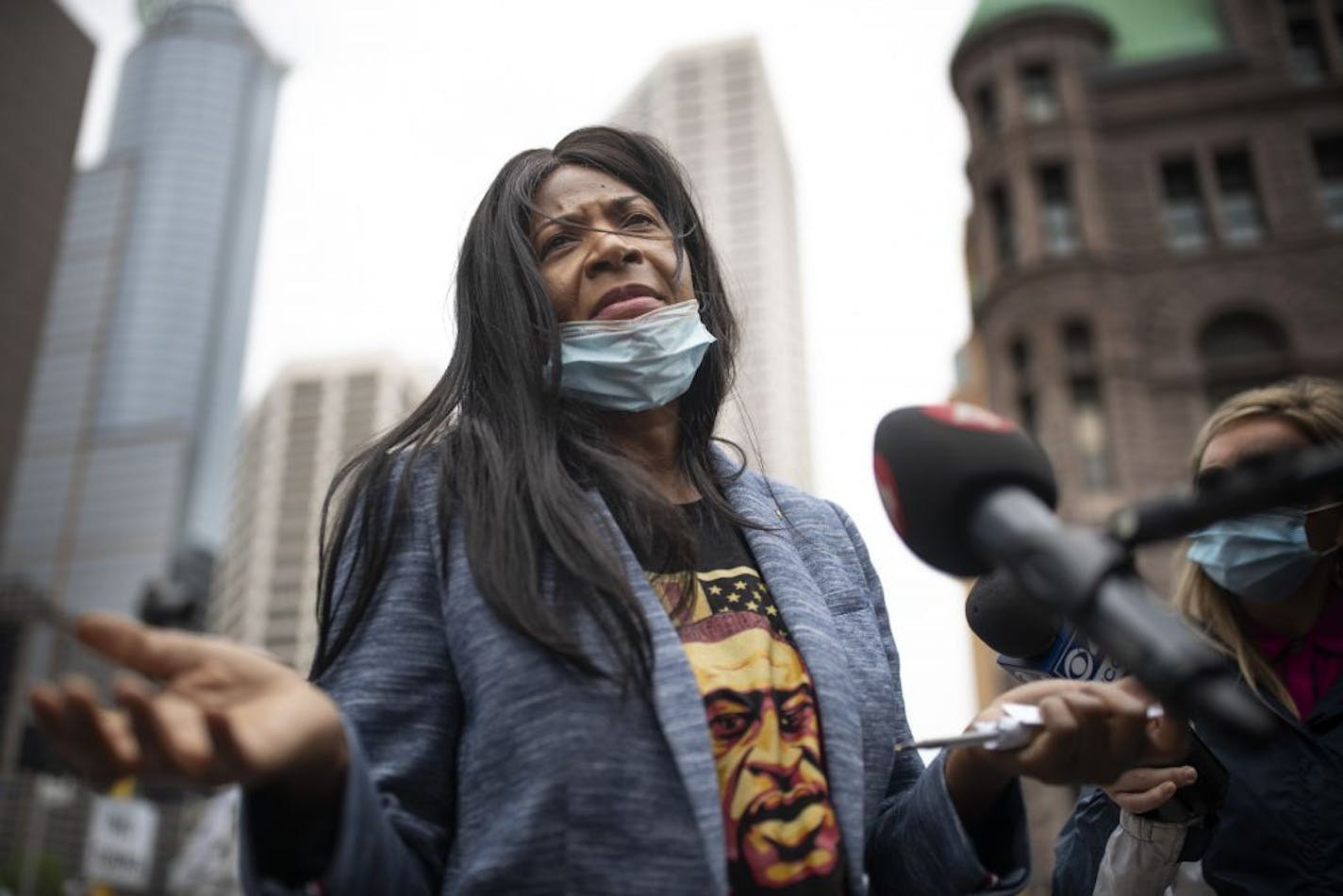 George Floyd 's aunt Angela Harrelson of Minneapolis spoke with members of the media outside of the Hennepin County Public Safety Facility Monday morning .