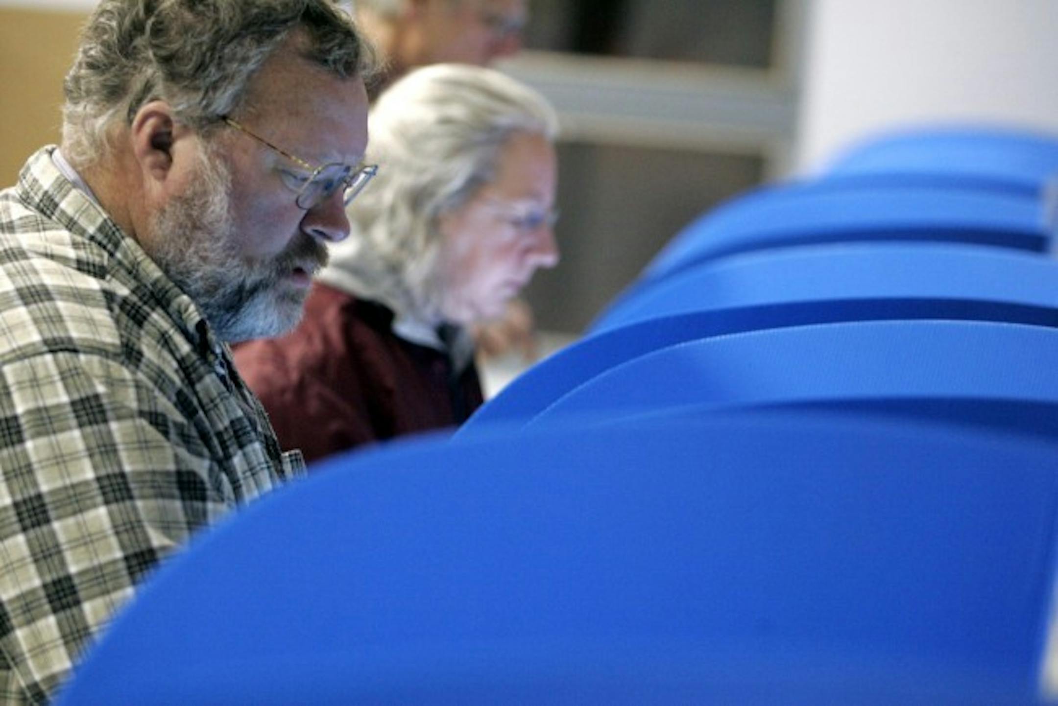 Voters cast their ballots early Tuesday in Bowling Green, Ohio. Polls show Democratic presidential hopefuls Sen. Hillary Clinton (D-N.Y.) and Sen. Barack Obama (D-IL.) in a virtual tie in Ohio.