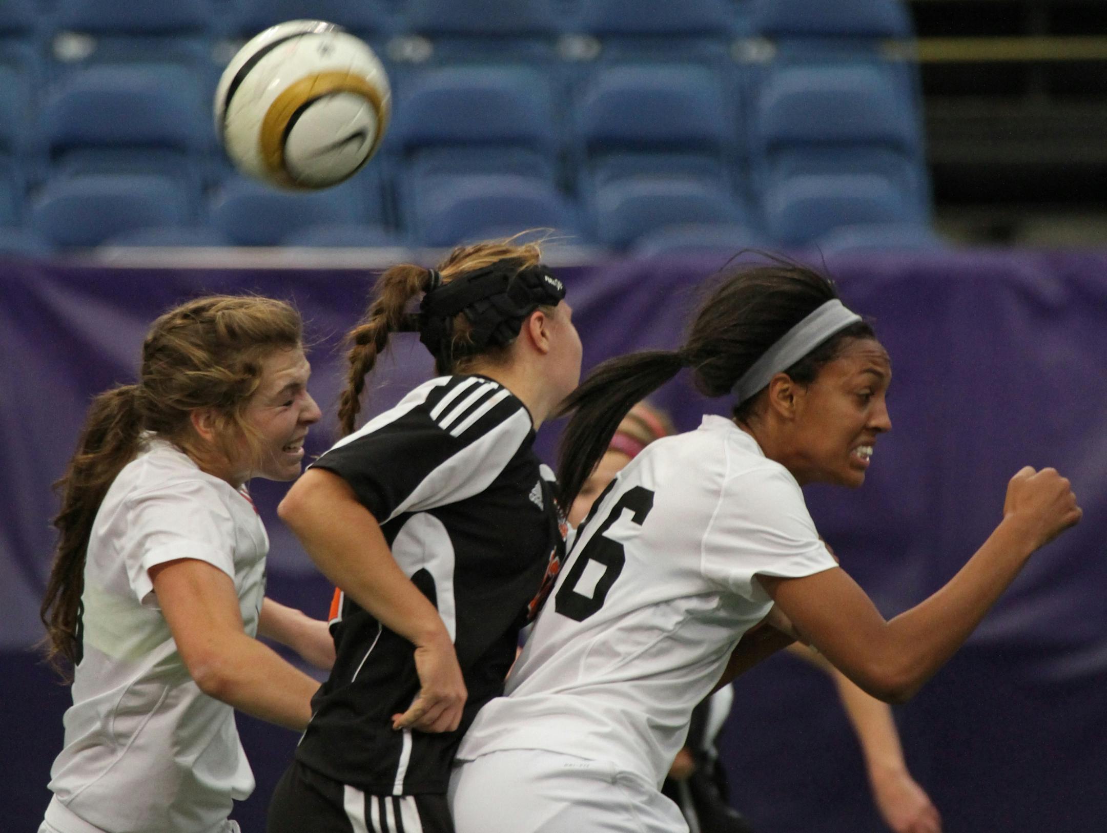 Class AA Girls Soccer State Tournament, Class AA Girls Semi-Finals, White Bear Lake vs. Lakeville North, 10/30/12, Metrodome. (lright) Lakeville North's Simone Kolander and other players headed the ball in first half action.