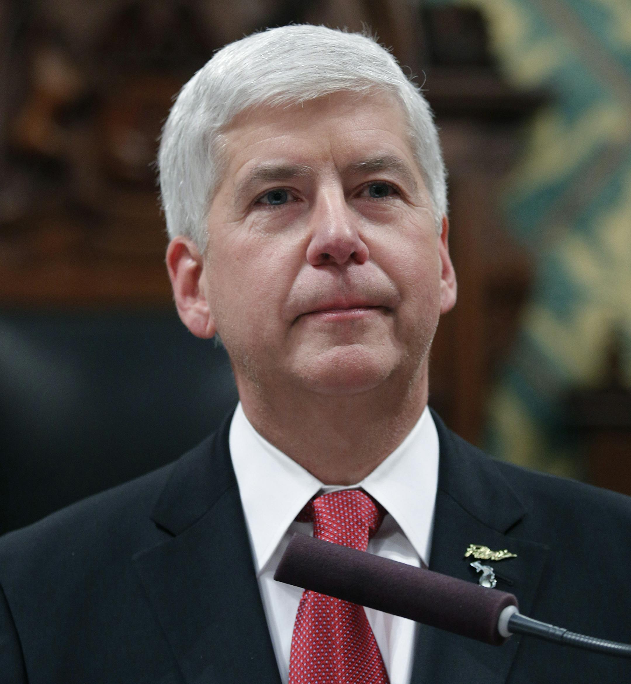 Michigan Gov. Rick Snyder delivers his State of the State address to a joint session of the House and Senate, Tuesday, Jan. 19, 2016, at the state Capitol in Lansing, Mich. With the water crisis gripping Flint threatening to overshadow nearly everything else he has accomplished, the Republican governor pledged a fix Tuesday night during his annual State of the State speech. (AP Photo/Al Goldis) ORG XMIT: MIN2016012112430021