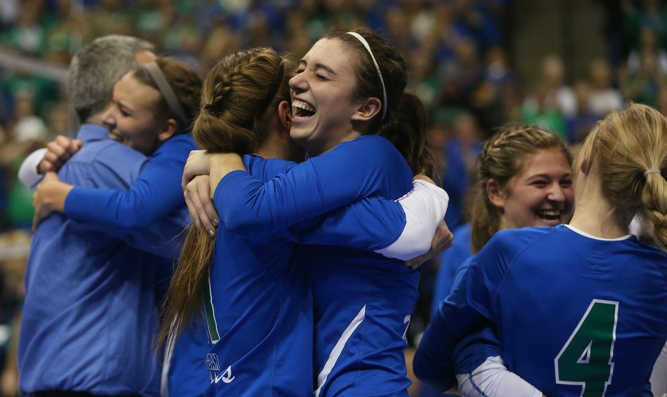 Eagan's Callie Schapekahm, left, hugged teammate Celia Bertsch after winning the state championship Class 3A finals at the Xcel Energy Center in St. Paul, Min., Saturday, November 9, 2013. Eagan won over Delano 3-2. ] (KYNDELL HARKNESS/STAR TRIBUNE) kyndell.harkness@startribune.com ORG XMIT: MIN1311091945510087