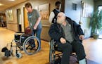 Danny Heskett learns that the manual wheelchair he is sitting in is too wide for the transportation van ramp at Good Samaritan Society in Albert Lea, 