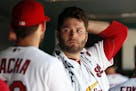 St. Louis Cardinals starting pitcher Lance Lynn, right, talks with fellow pitcher Michael Wacha after being removed during the sixth inning in the fir