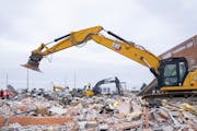 Wrecking equipment began to tear into the Herberger’s and Toys ‘R’ Us buildings in Bloomington on Tuesday.