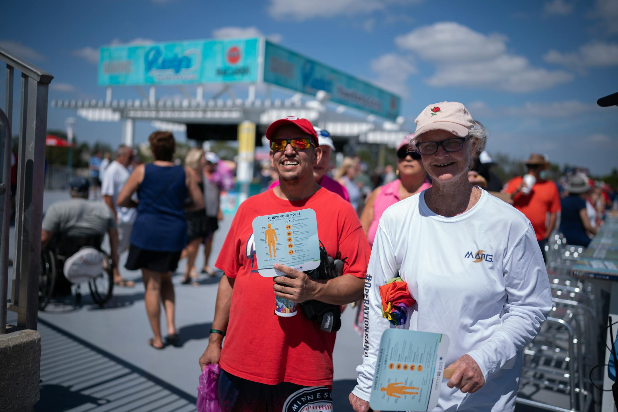 Minnesota Twins fans Josh Seeman, left, and Patty Vanderwall, both residents of the Twin Cities, enjoyed the hot sunny weather Saturday at Hammond Stadium.