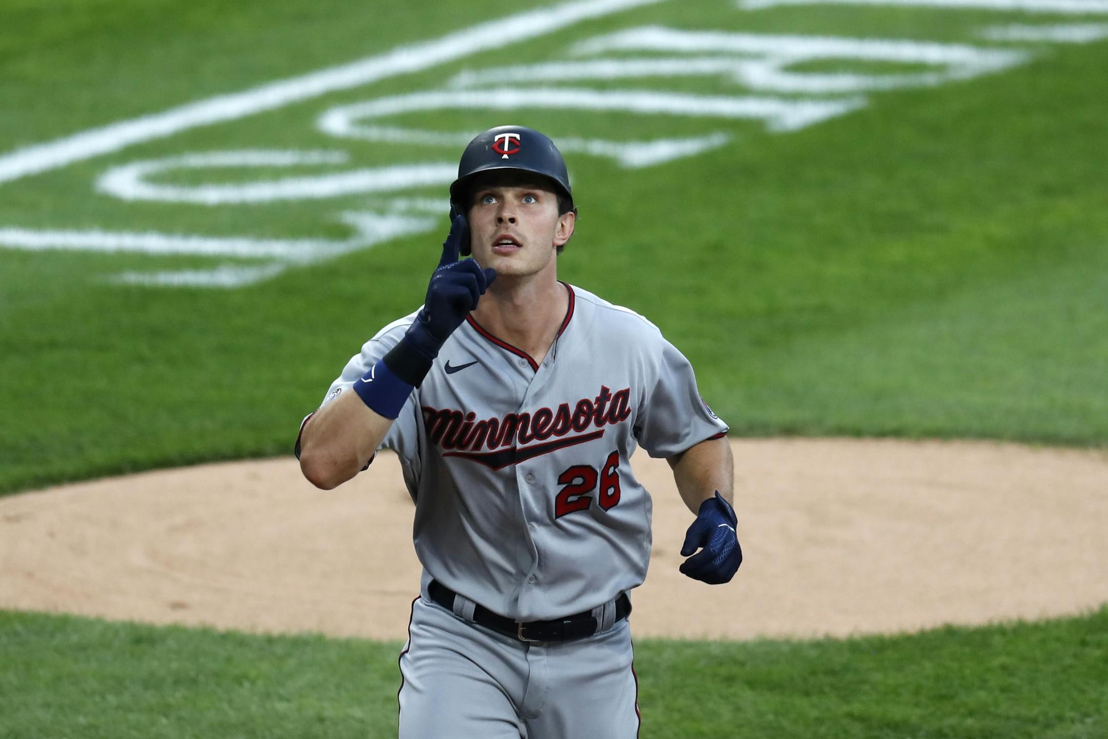 Minnesota Twins' Max Kepler celebrates his second home run off Chicago White Sox starting pitcher Lucas Giolito, during the second inning of a baseball game Friday, July 24, 2020, in Chicago.