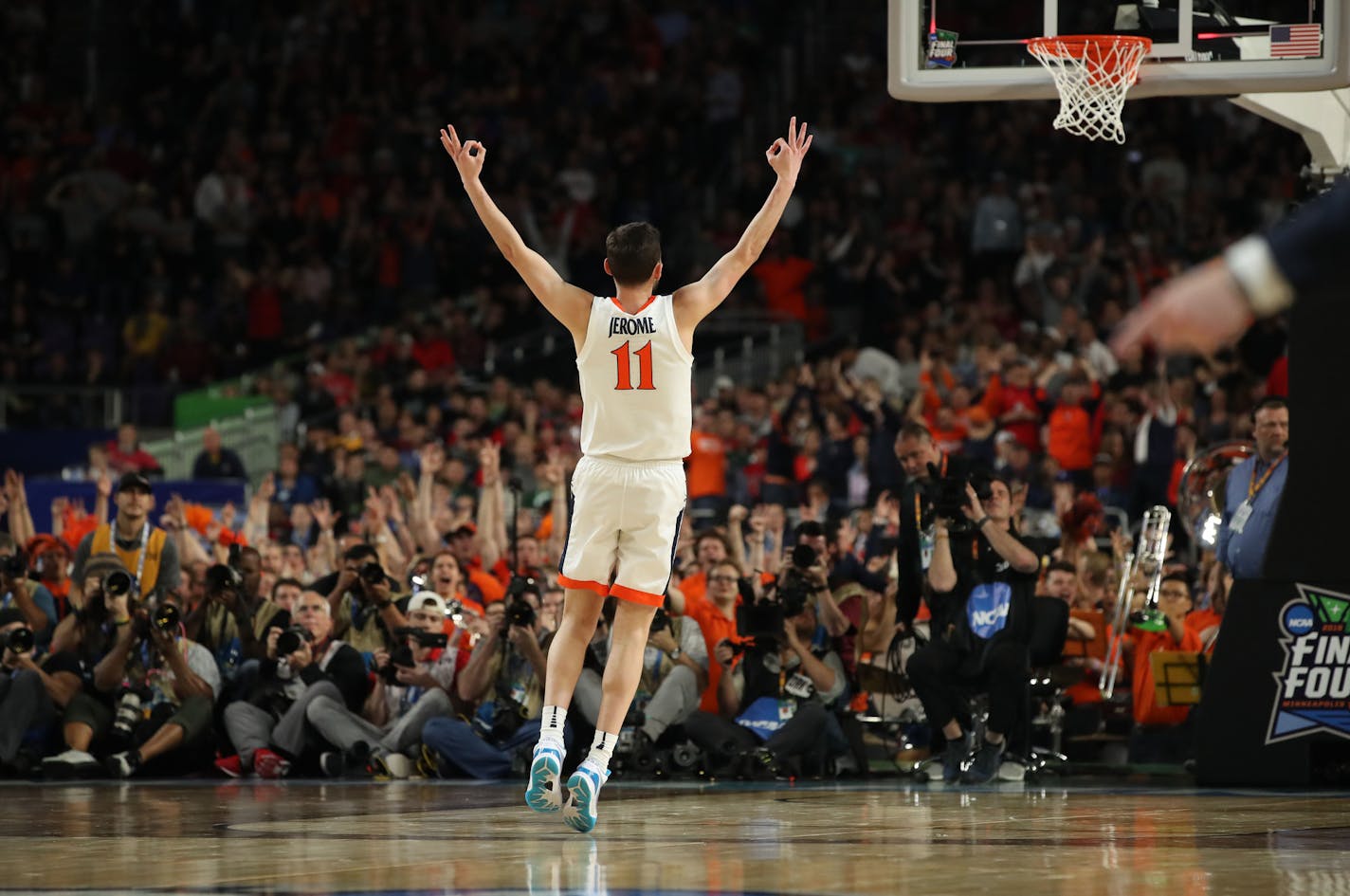 Ty Jerome (bottom) reacted after making a three-pointer.