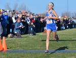Cotter seventh-grade Grace Ping leads the race by nearly a minute as she nears the finish line of the girls' Class 1A state cross country championship