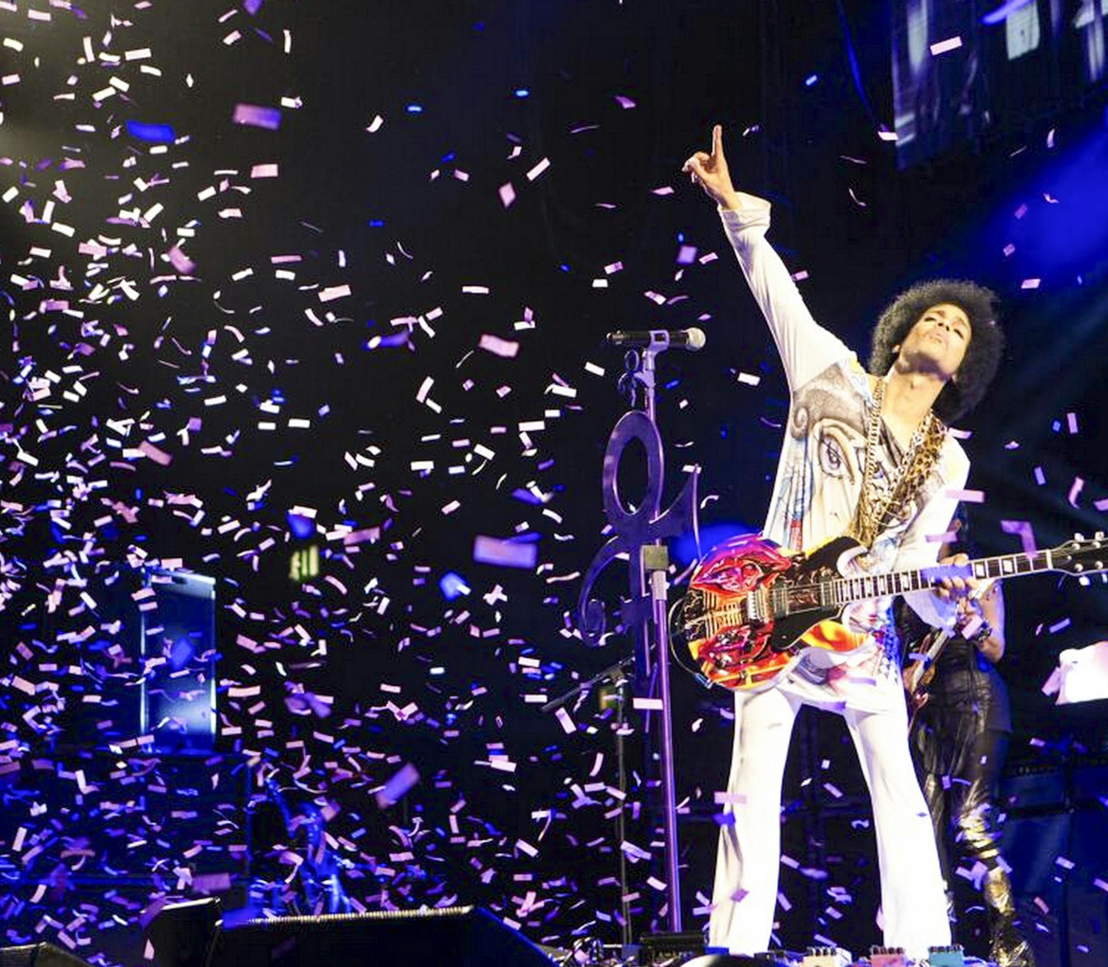 In an undated handout photo, Prince performs in Birmingham, England. In his latest confounding move, Prince has simultaneously released two albums: ‚ÄúArt Official Age,‚Äù a studio production billed as his first solo album since 2010 and ‚ÄúPlectrumElectrum,‚Äù on which he‚Äôs backed by the three-woman rock trio he has been touring with, 3rdEyeGirl. (NPG Records via The New York Times) -- NO SALES; FOR EDITORIAL