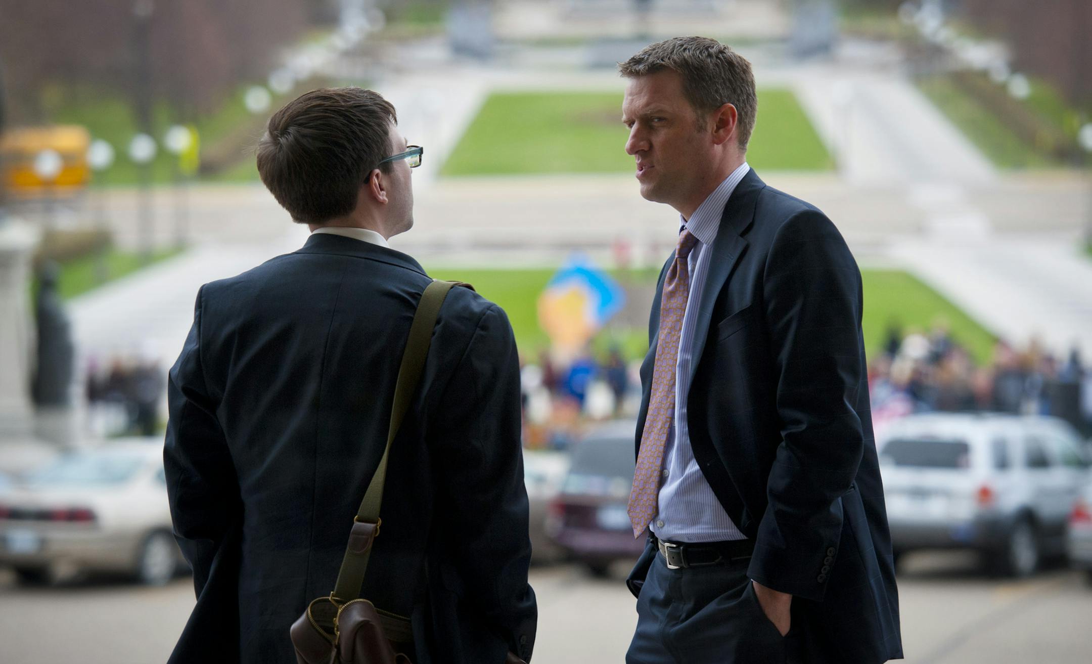 House Minority Leader Kurt Daudt, right took time on the Capitol steps, between floor sessions, to talk with his executive assistant Bobby Patrick, left, about amendments to todays transportation bill, Thursday, May 2, 2013 ] GLEN STUBBE * gstubbe@startribune.com