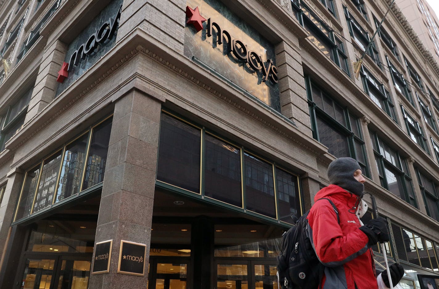 Jordan Strom waited to cross South 7th Street near the downtown Macy's Thursday. ] ANTHONY SOUFFLE &#x2022; anthony.souffle@startribune.com Pedestrians walk past the Macy's Thursday, Jan. 5, 2016 on Nicollet Mall in Minneapolis. It's overhaul will be a daunting task that has already beleaguered other cities with shuttered downtown stores.