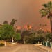 A wildfire burns in the hills just north of the San Gabriel Valley community of Glendora, Calif., on Thursday, Jan 16, 2014. Southern California autho