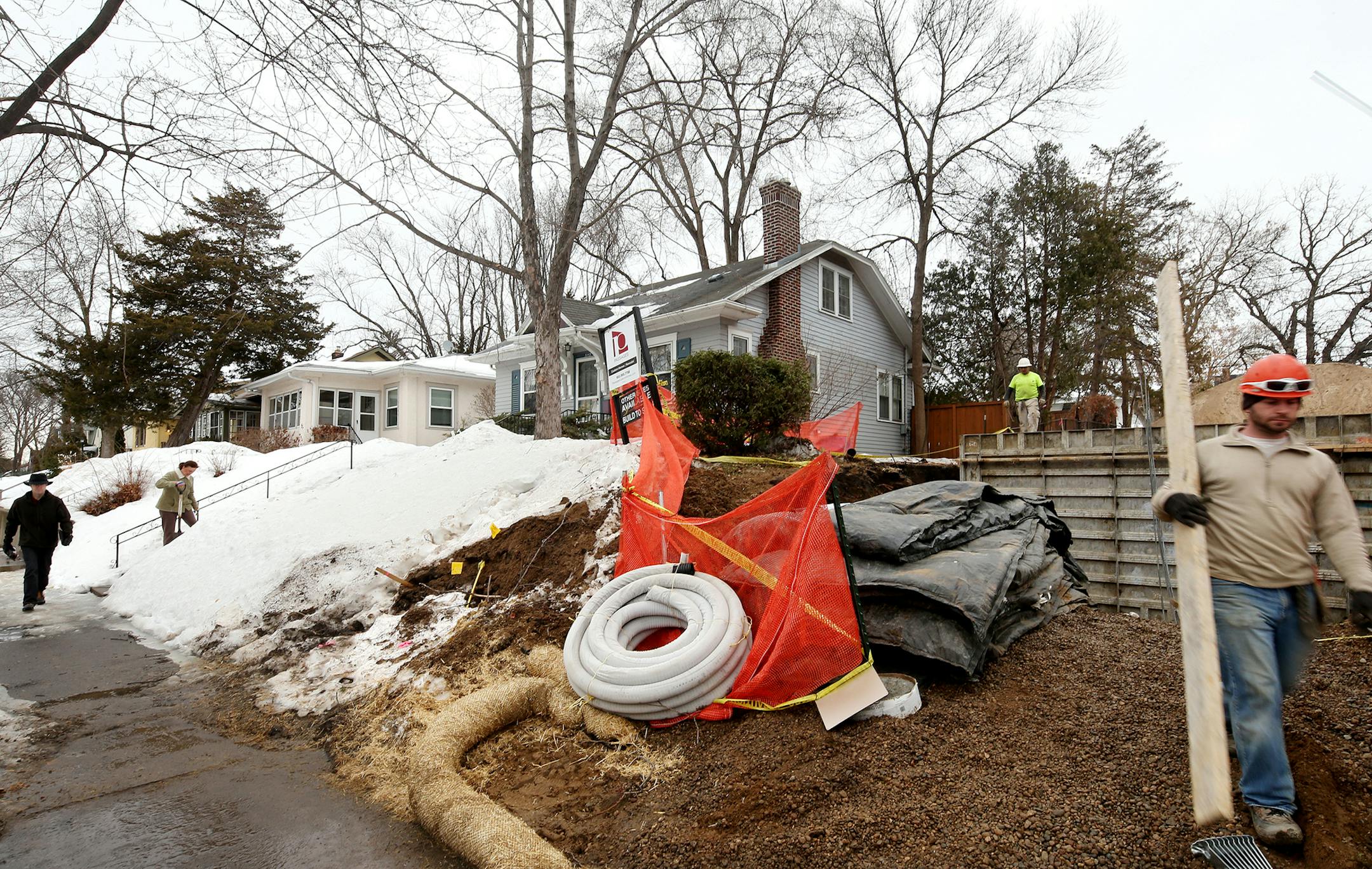Sharon Potter (left center) of Minneapolis shovels her walkway as construction has started on a teardown next to her home on the 5100 block of York. ] JOELKOYAMA‚Ä¢jkoyama@startribune March 11, 2014 Six years after Minneapolis thought it had solved the teardown-and-build-new housing problem, it's back in a big way. Calling it the most urgent issue in her southwest ward, new city council member Linea Palmisano engineered an immediate moratorium on the demolition and construction