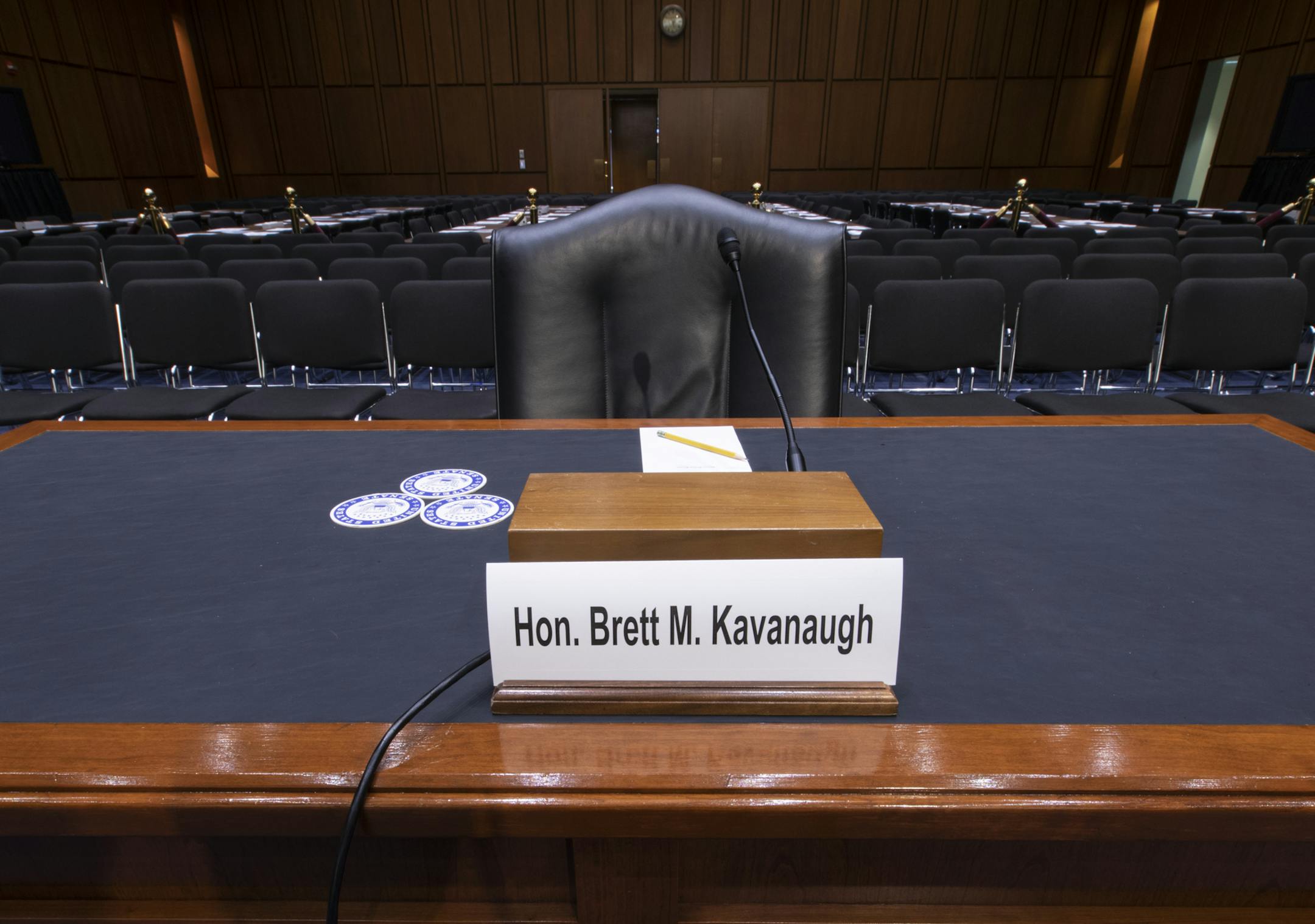 The witness table is prepared for President Donald Trump's Supreme Court nominee, Brett Kavanaugh, in the Senate Judiciary Committee hearing room on Capitol Hill in Washington, Monday, Sept. 3, 2018. (AP Photo/J. Scott Applewhite)