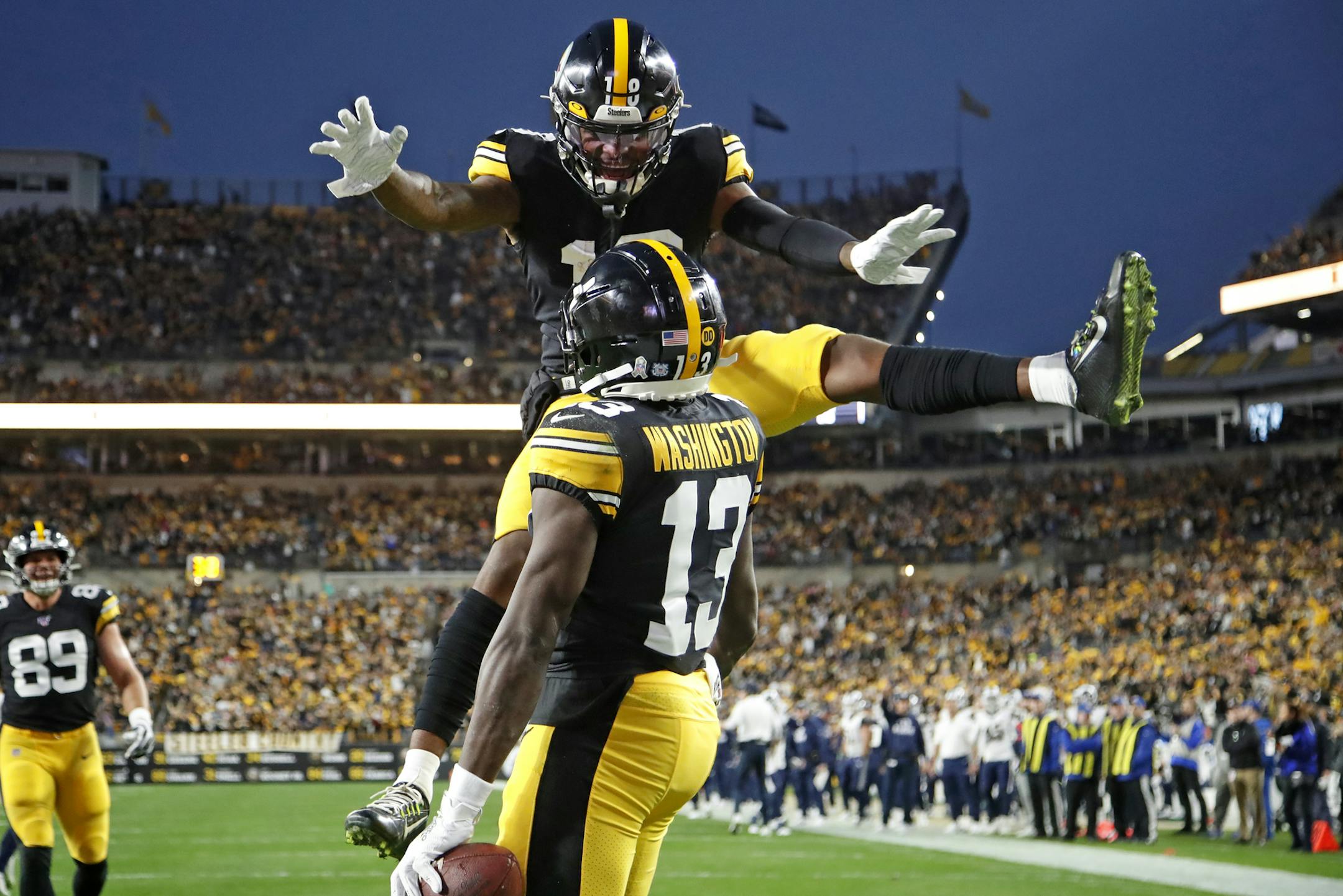 Pittsburgh Steelers wide receiver James Washington (13) celebrates his touchdown catch with Diontae Johnson (18) during the first half of an NFL football game in Pittsburgh, Sunday, Nov. 10, 2019. (AP Photo/Don Wright)
